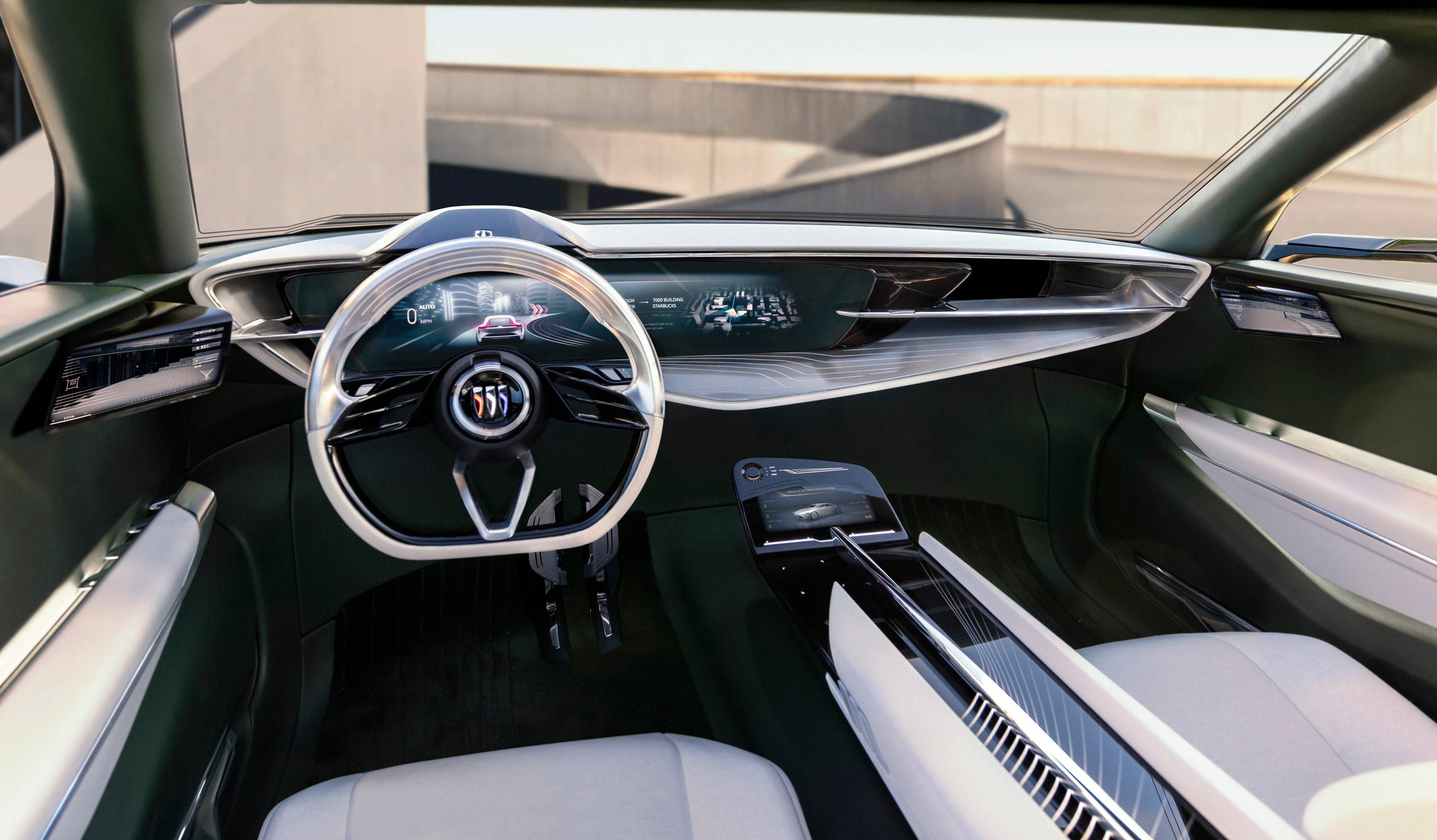 Buick 桌布 壁紙 — 豪華車內裝，配備未來感儀表板和時尚銀色飾邊，在明亮日光下。