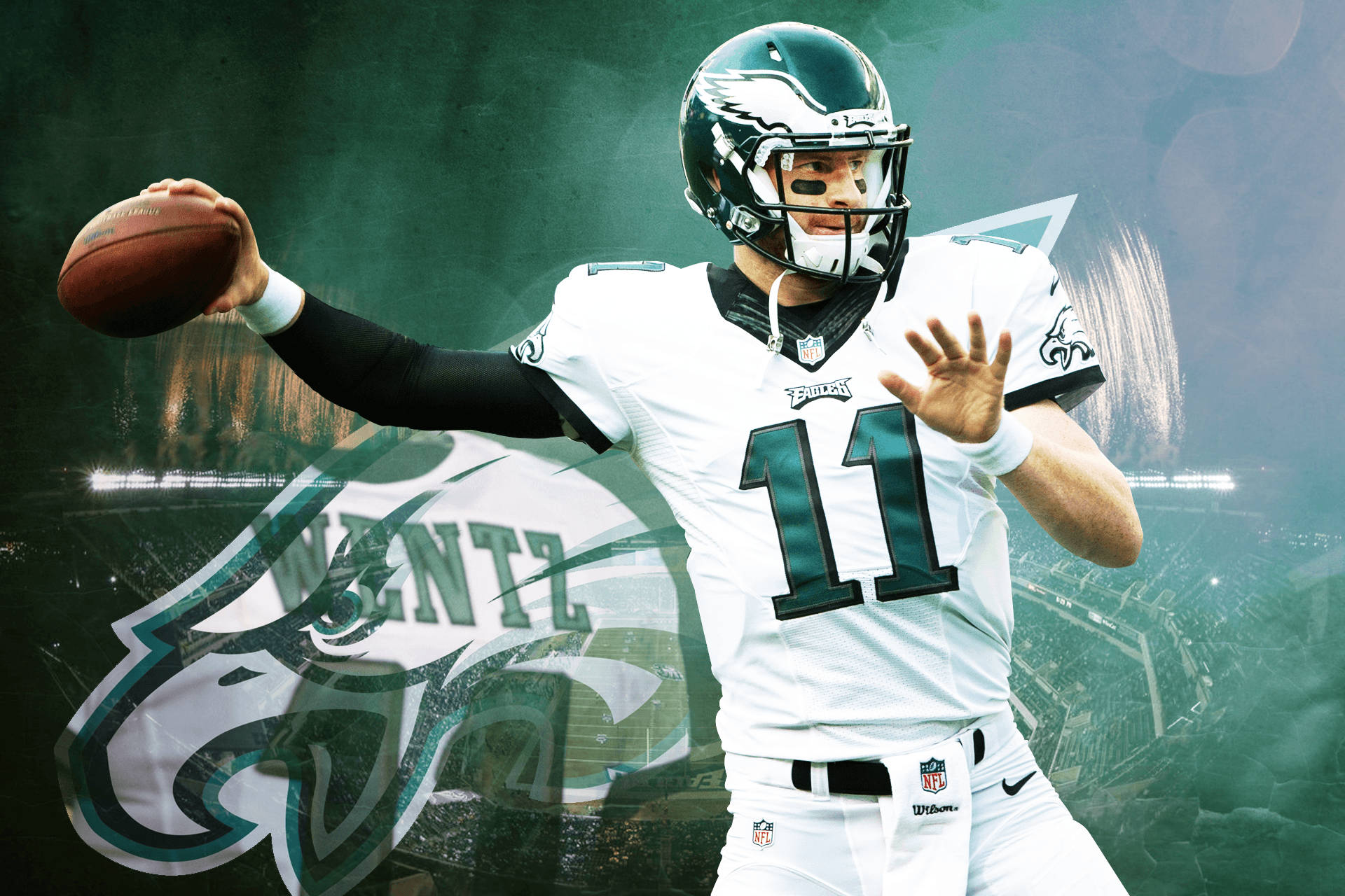運動 桌布 壁紙 — 費城老鷹隊四分衛 Carson Wentz 身穿白色11號球衣，在球場背景下擲球，附有球隊標誌。