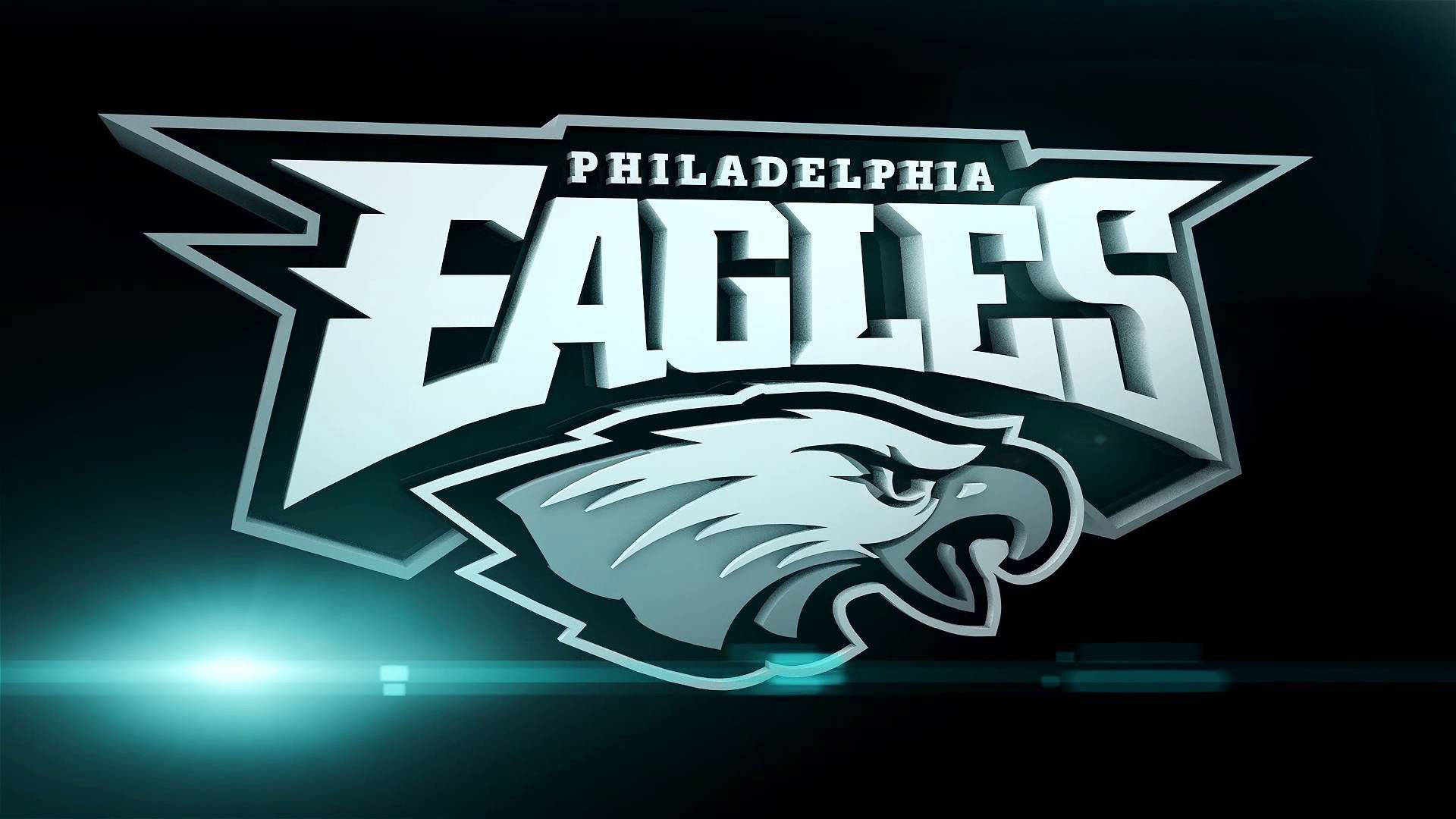 Eagles 桌布 壁紙 — 費城老鷹隊標誌，金屬鷹頭和粗體文字在深色背景上發光，帶有青綠色燈光效果。