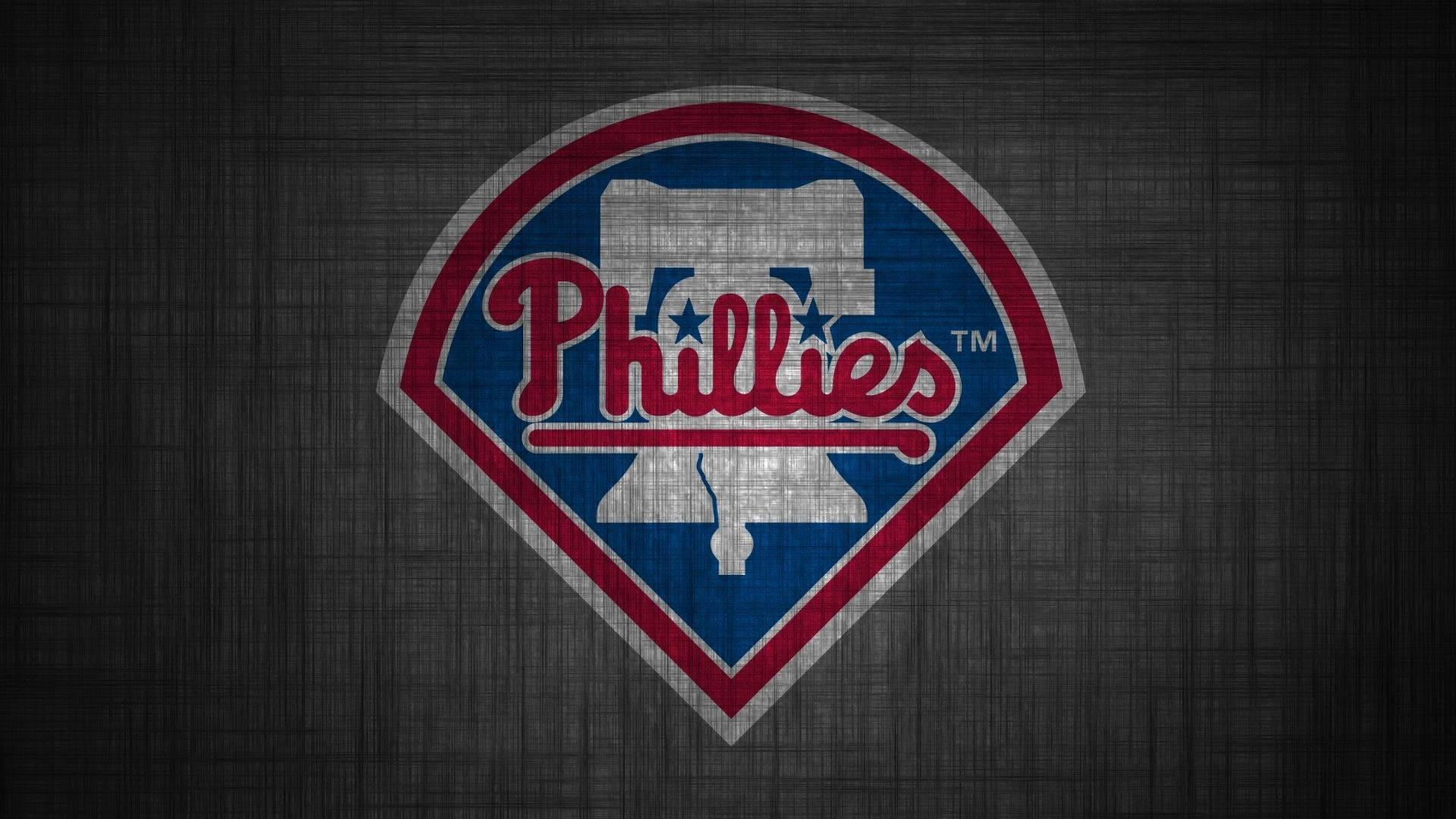 Phillies 桌布 壁紙 — 費城費城人棒球標誌，以紅、藍、白色呈現，置於深色紋理背景上。