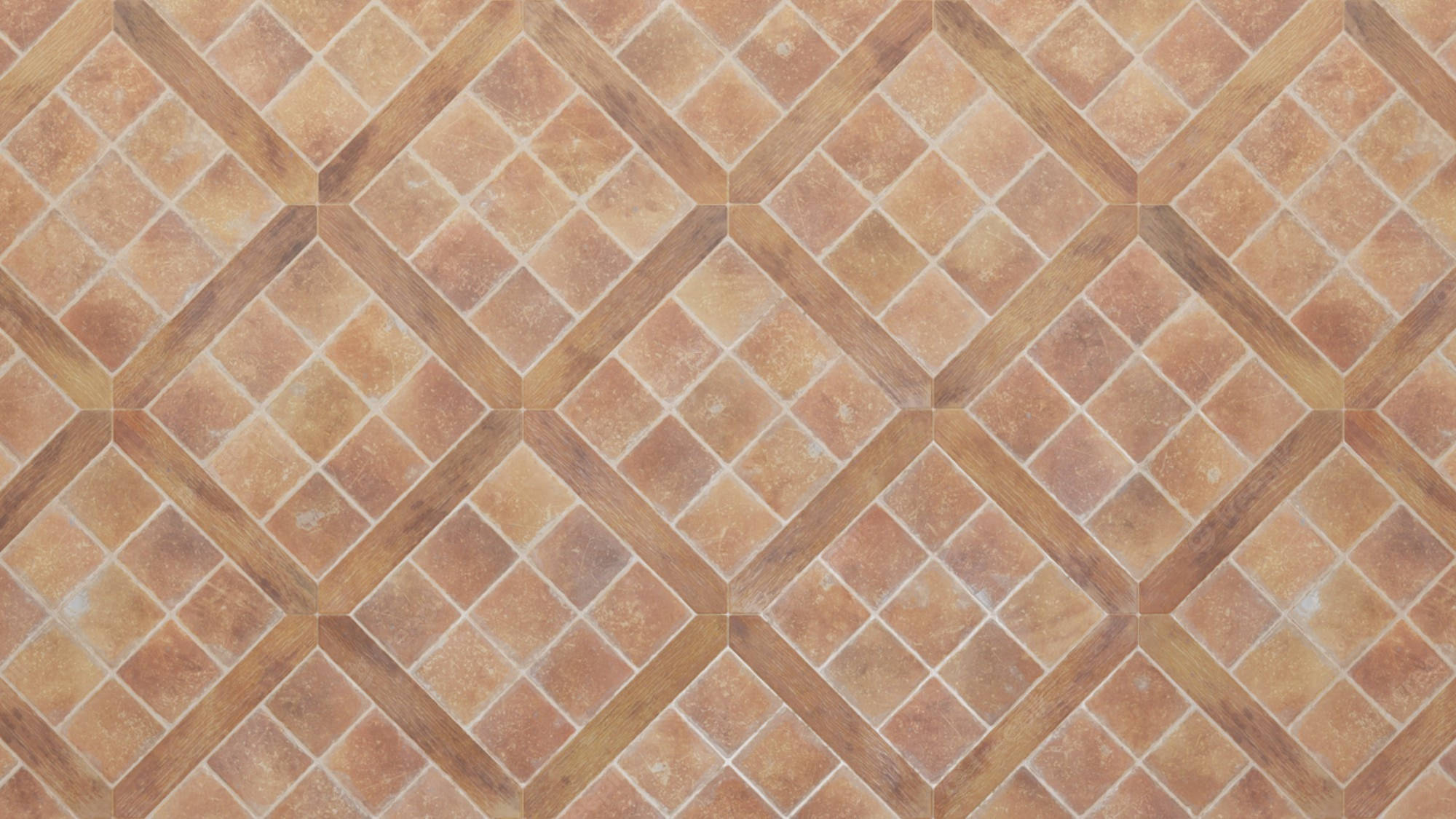 Floor Tiles 桌布 壁紙 — 赤陶磚以菱形圖案排列的特寫，帶有溫暖的大地色調和細膩的紋理。