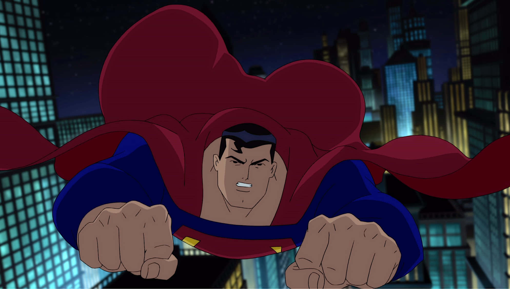 Superman The Animated Series 桌布 壁紙 — 超人在夜晚飛過霓虹燈照亮城市景觀，披風飄揚，拳頭緊握，充滿決心。