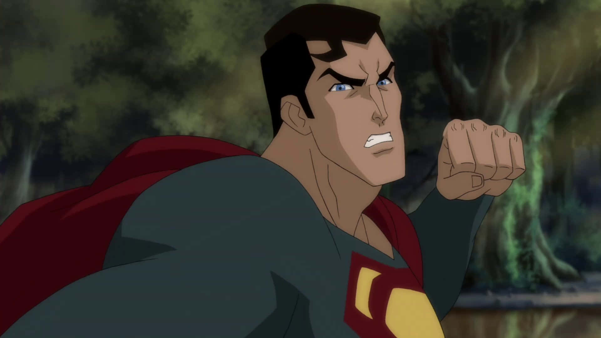 Superman Unbound 桌布 壁紙 — 超人在黑暗森林中握緊拳頭，表情兇猛。