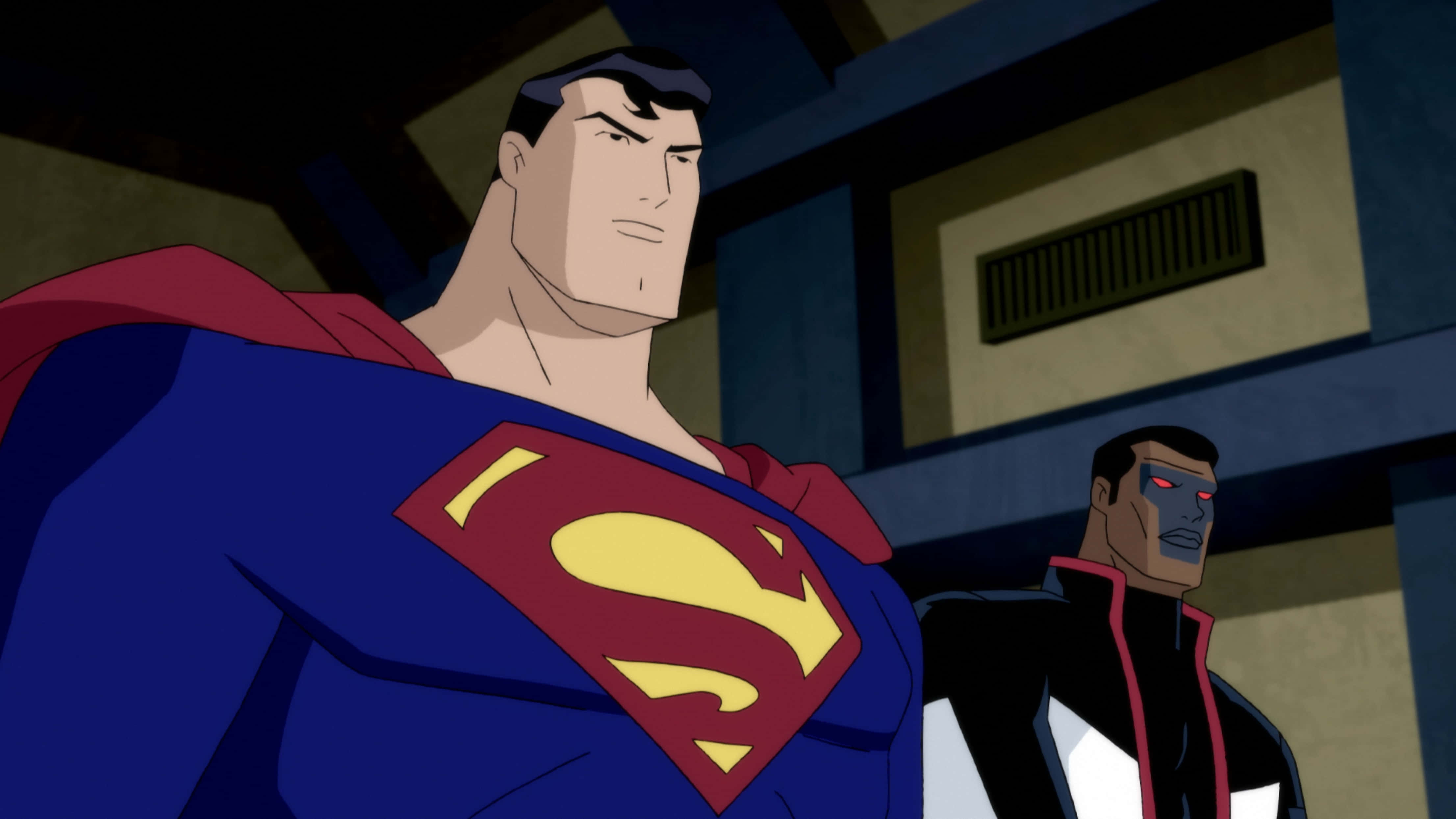 Superman The Animated Series 桌布 壁紙 — 超人穿著標誌性的藍色戰衣、紅色斗篷和黃色「S」盾牌高高站立，而一個戴面具、眼睛發出紅光的角色在昏暗的城市環境中潛伏在他身後。