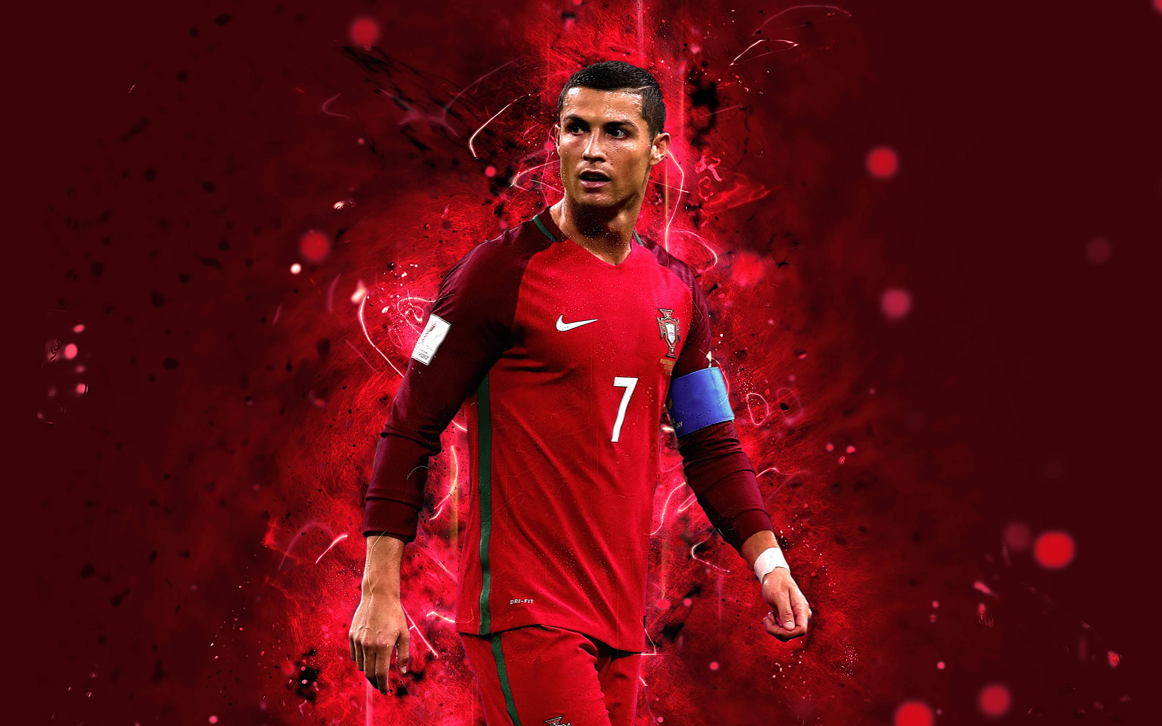 Ronaldo 桌布 壁紙 — 足球員克里斯蒂亞諾·羅納度身穿葡萄牙紅色7號球衣，站在動態紅色能量爆發背景前。