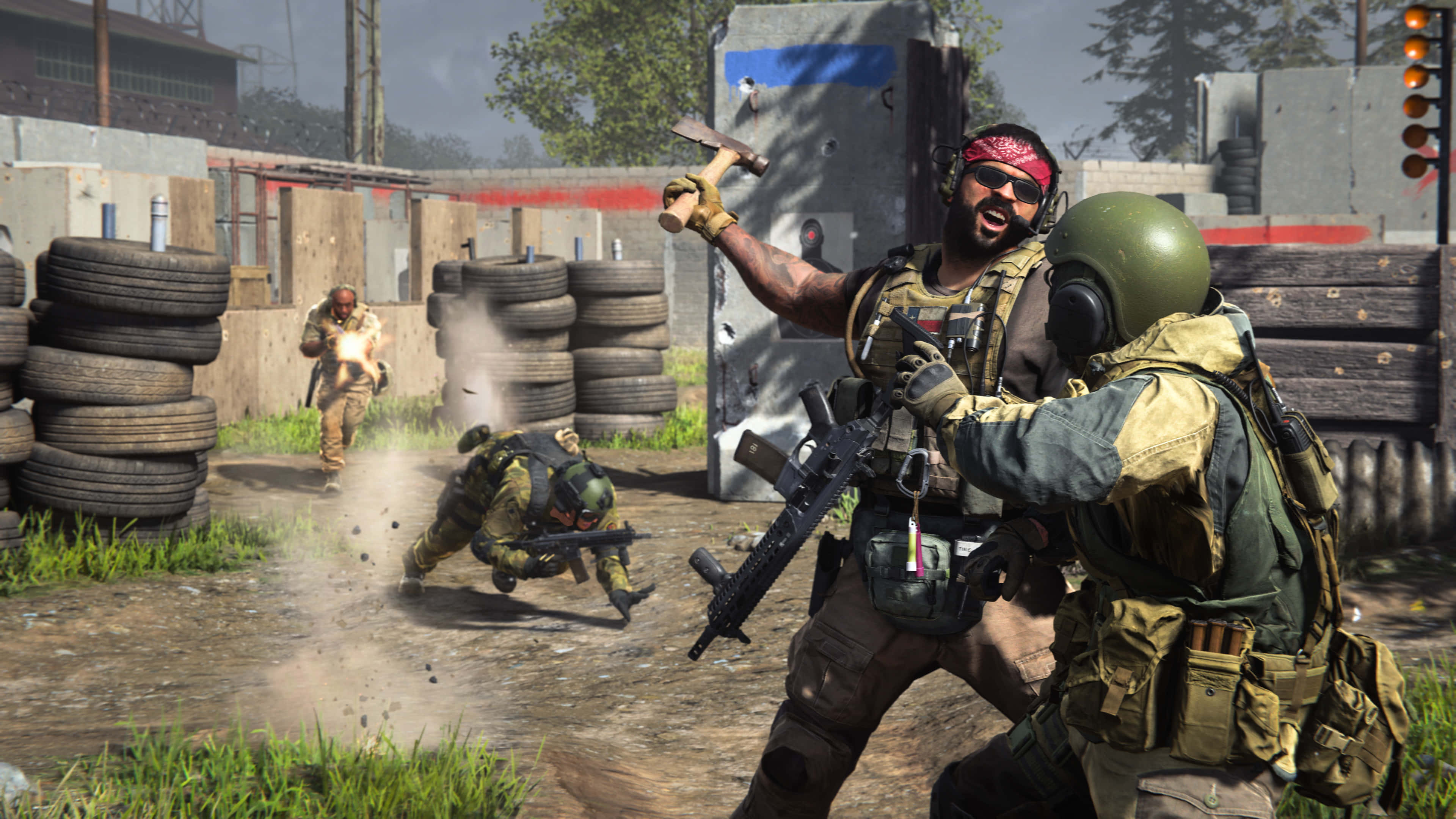 HD Call Of Duty Modern Warfare 桌布 壁紙 — 身穿戰術裝備的士兵在一個粗糙的戶外戰鬥區域中衝突，該區域有堆疊的輪胎和混凝土障礙物。