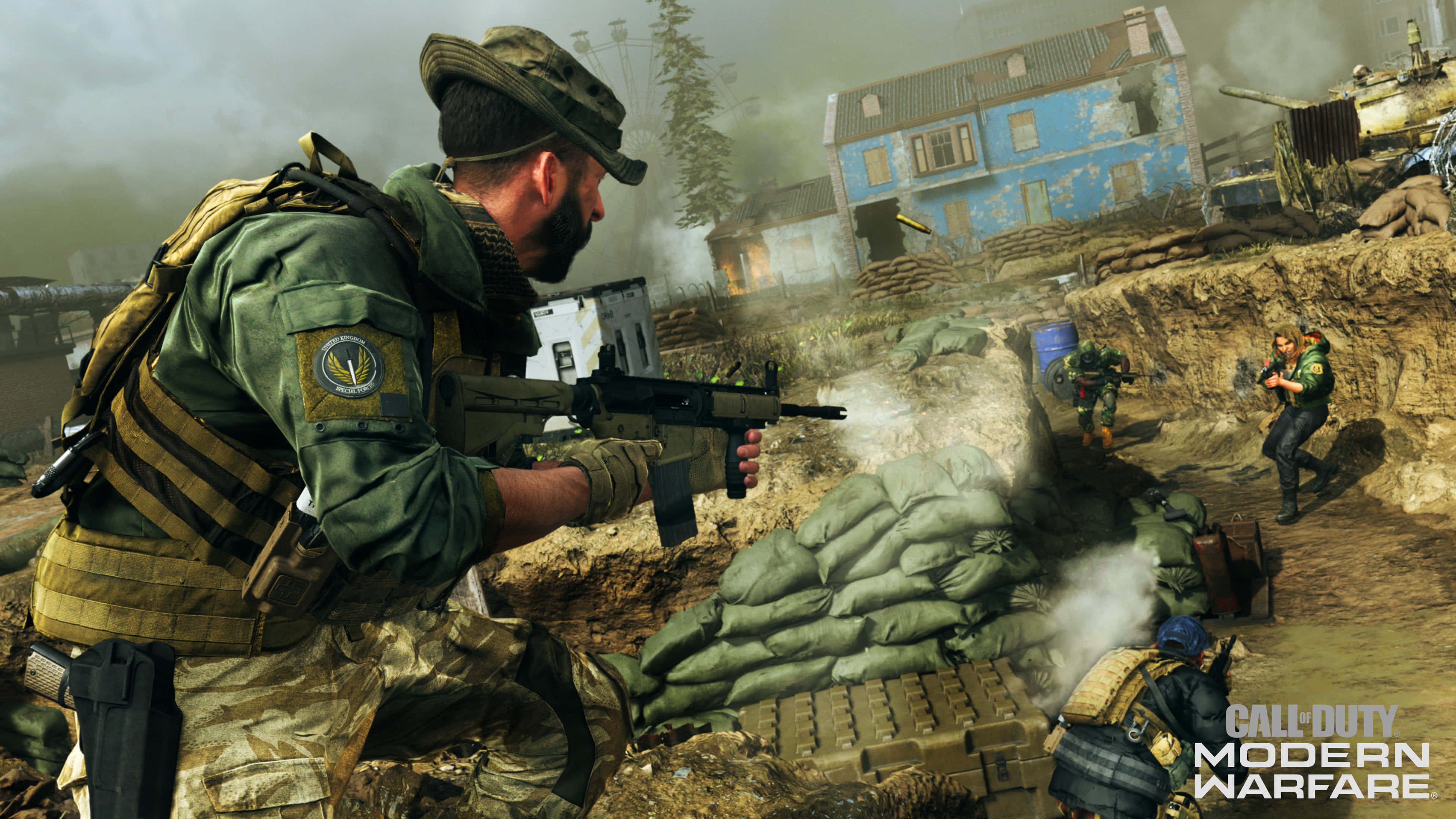 HD Call Of Duty Modern Warfare 桌布 壁紙 — 身穿戰鬥裝備的士兵在煙霧和沙袋中，於一個被戰爭摧毀、有受損藍色建築物的村莊裡開火。