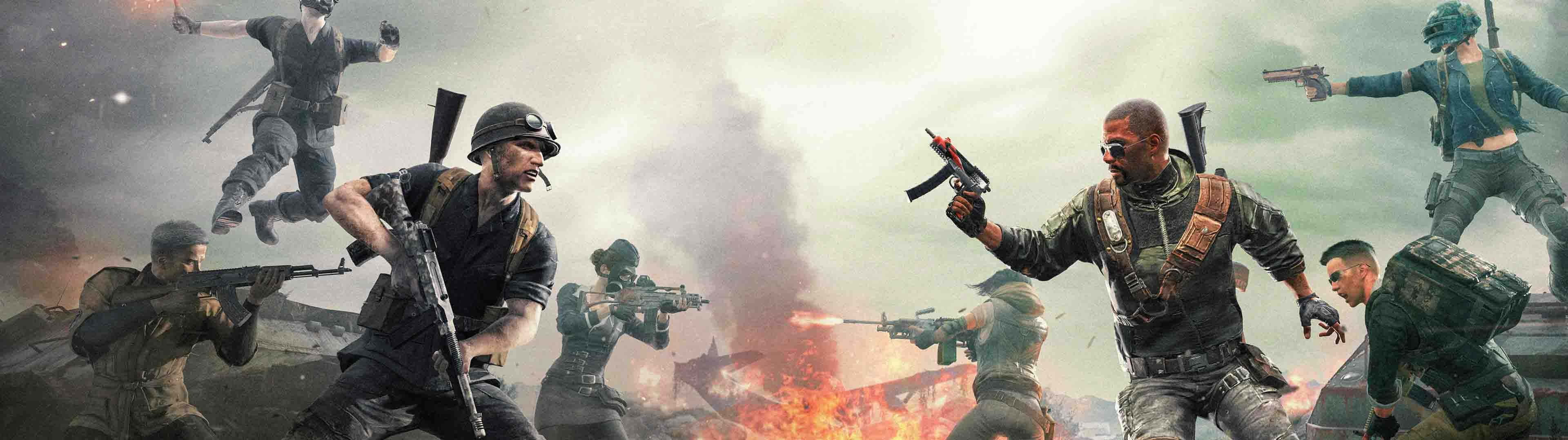 3840 X 1080 Gaming 桌布 壁紙 — 身穿戰鬥裝備的士兵在煙霧和爆炸環繞的熾熱戰場上交戰。