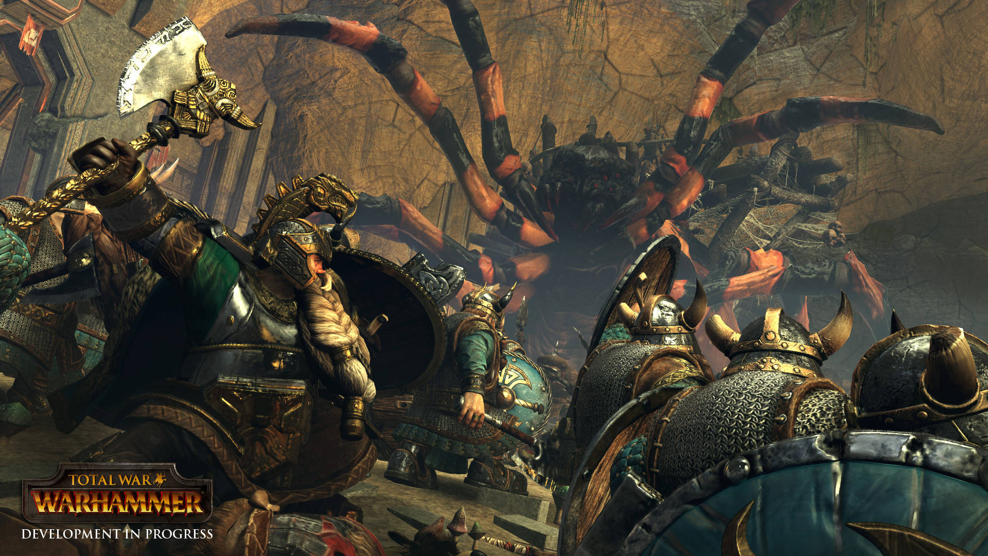 Total War Warhammer 2 桌布 壁紙 — 身穿盔甲的戰士在黑暗的洞穴戰場上與巨型蜘蛛交鋒。