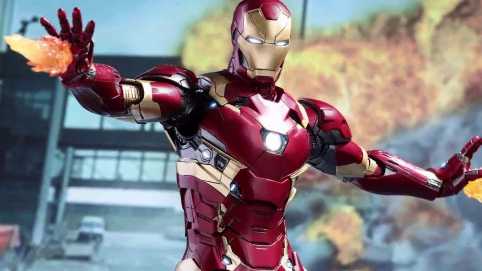 Vibranium Suit 桌布 壁紙 — 身穿紅色和金色盔甲的鋼鐵人，在模糊的城市背景下從雙手發射斥力光束。