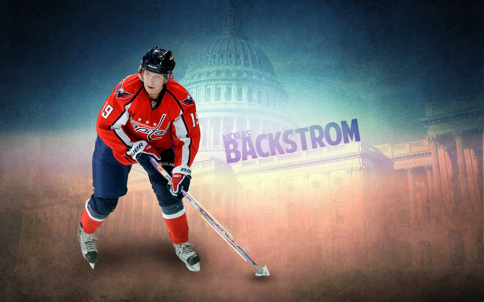 Sweden 桌布 壁紙 — 身穿紅色球衣的冰球運動員 Nicklas Backstrom 在模糊的國會大廈背景下持棍滑冰。