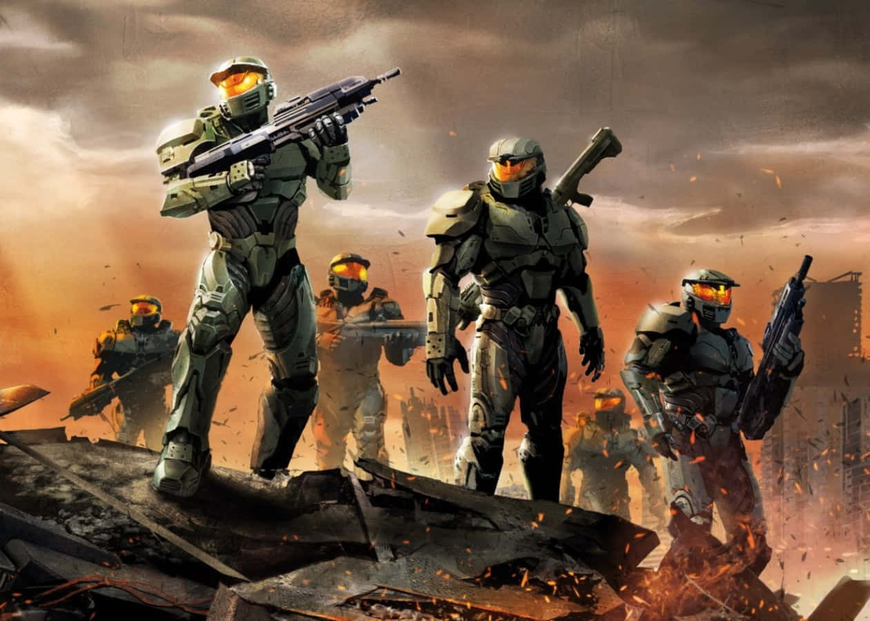 Halo Spartans 桌布 壁紙 — 身穿綠色盔甲的士兵站在瓦礫上，頭頂是火紅的橙色天空，火花在他們周圍飛舞。