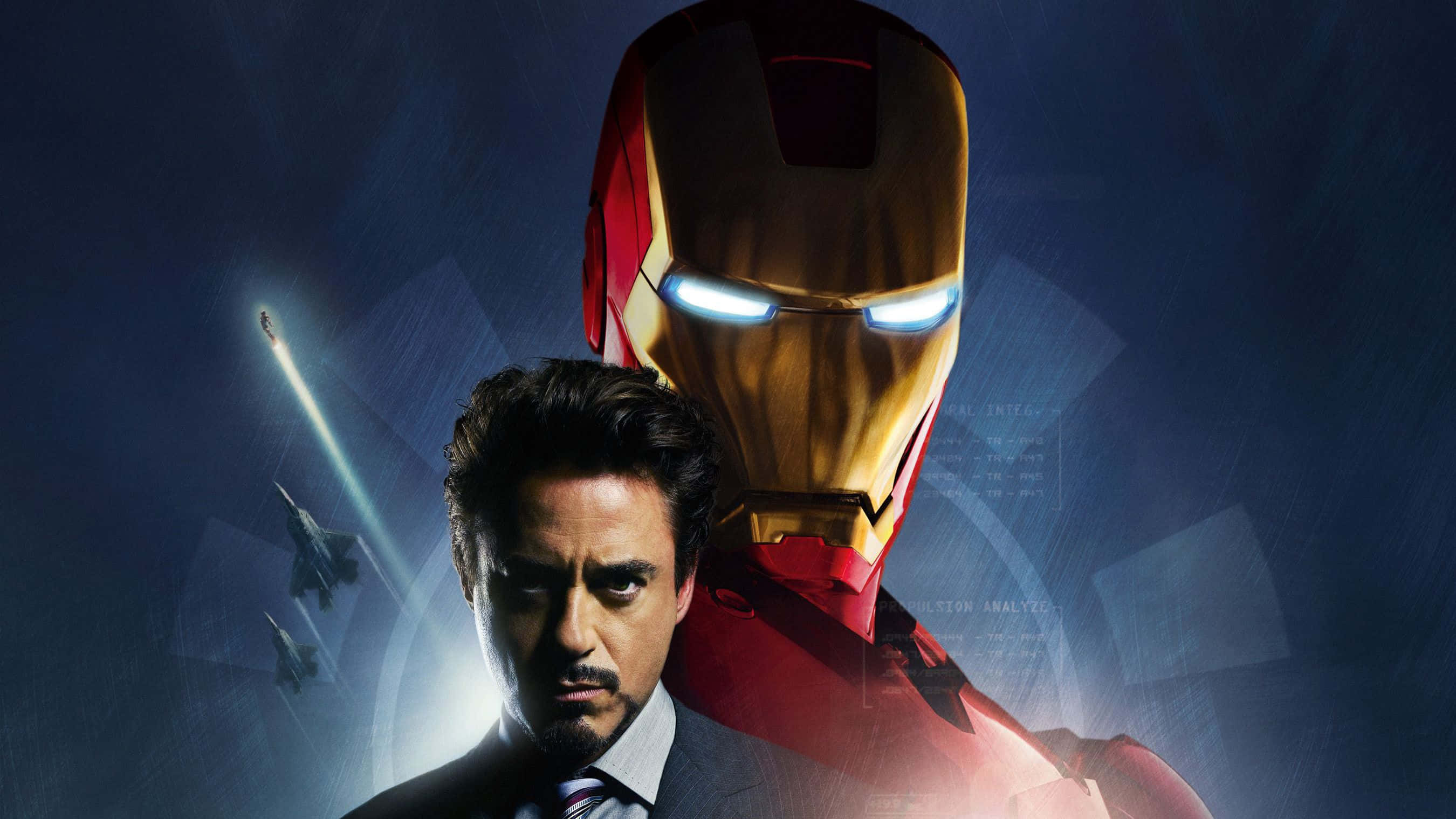 Iron Man Movies 桌布 壁紙 — 身穿西裝的東尼·史塔克站在發光的鋼鐵人頭盔前，背景是深藍色，有戰鬥機飛過。