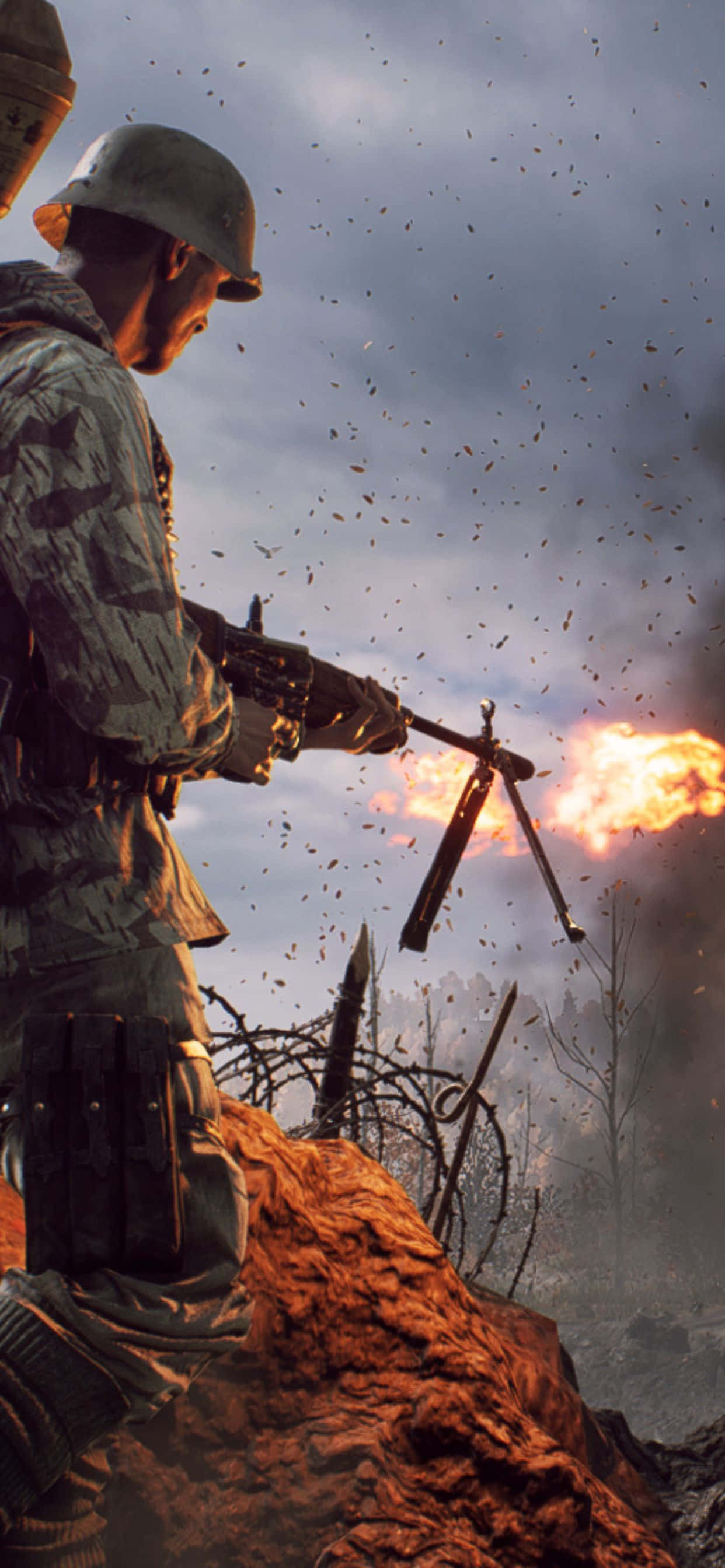 Battlefield V 桌布 壁紙 — 身穿迷彩服的士兵發射機槍，爆炸和碎片在煙霧瀰漫的戰場天空中飛舞。