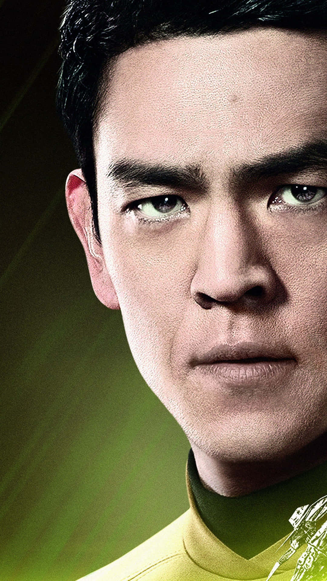 John Cho 桌布 壁紙 — 身穿黃色制服男士的特寫肖像，背景為發光綠色，帶有戲劇性燈光。