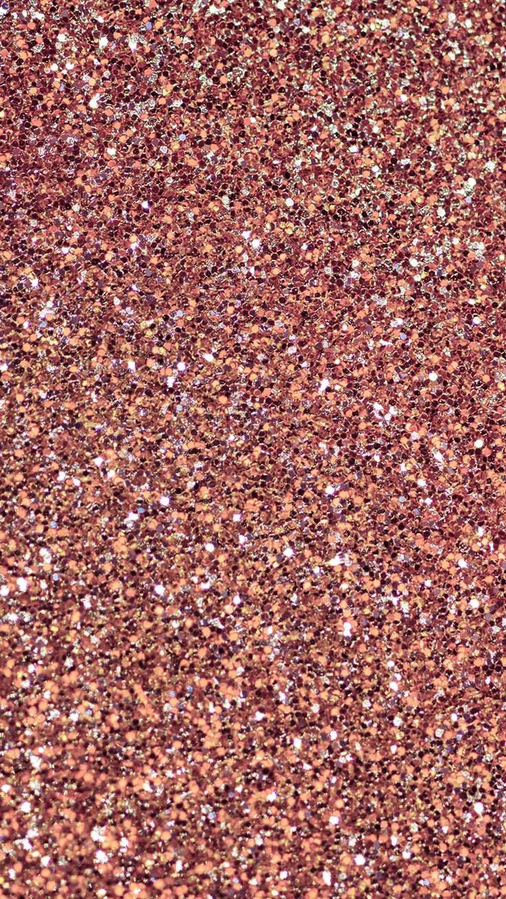 Pink Glitter 桌布 壁紙 — 近距離拍攝密集的玫瑰金亮粉，帶有閃爍的銀色碎片捕捉光線。