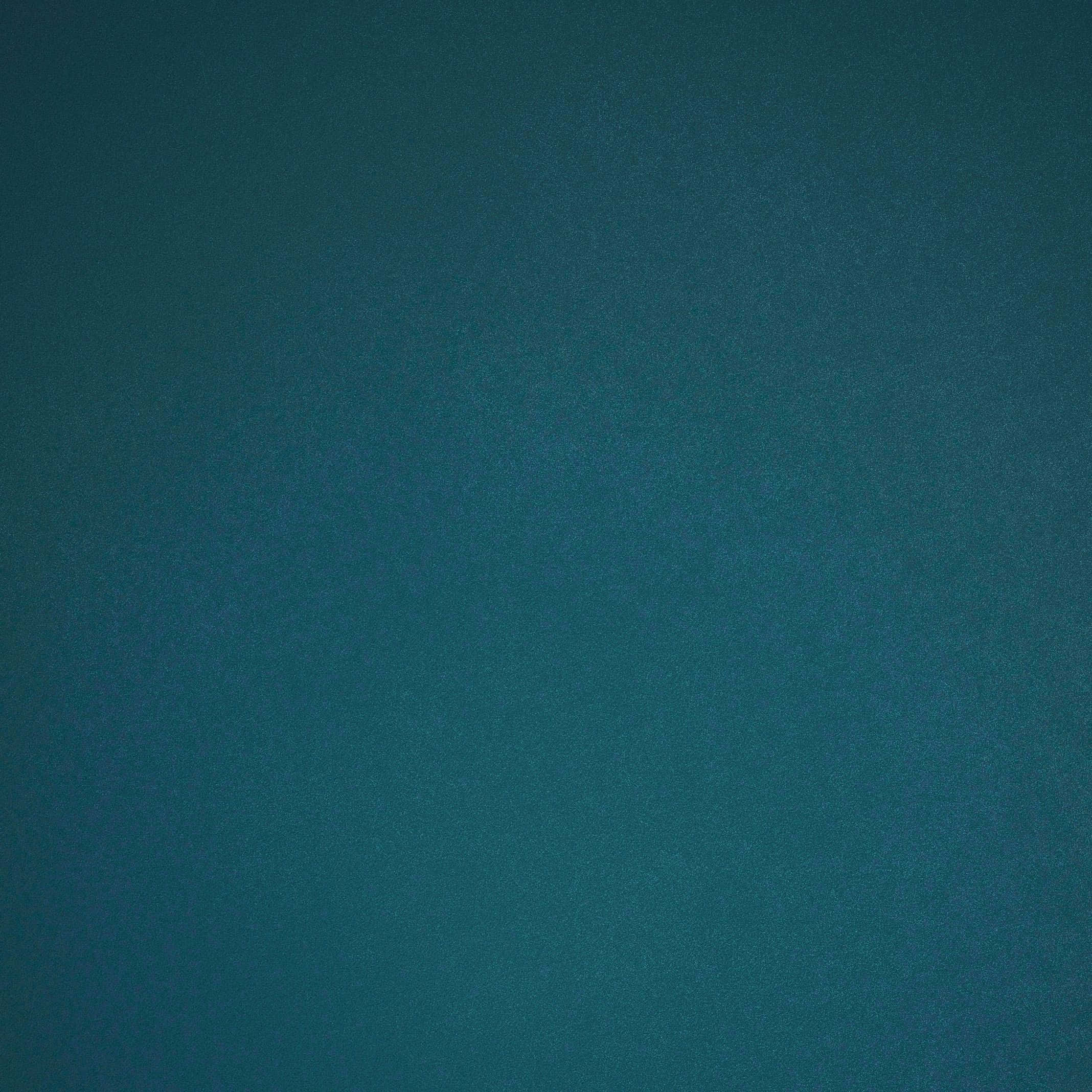青色GIF 桌布 壁紙 — 近距離拍攝平滑的藍綠色布料，帶有細微紋理和漸變陰影。