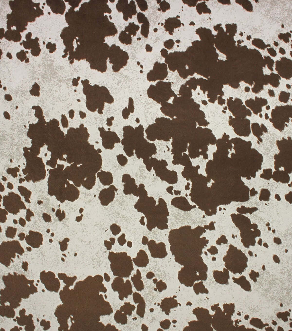 Cowhide 桌布 壁紙 — 近距離拍攝的紋理壁紙，淺灰色背景上有不規則的棕色斑點，類似牛皮。