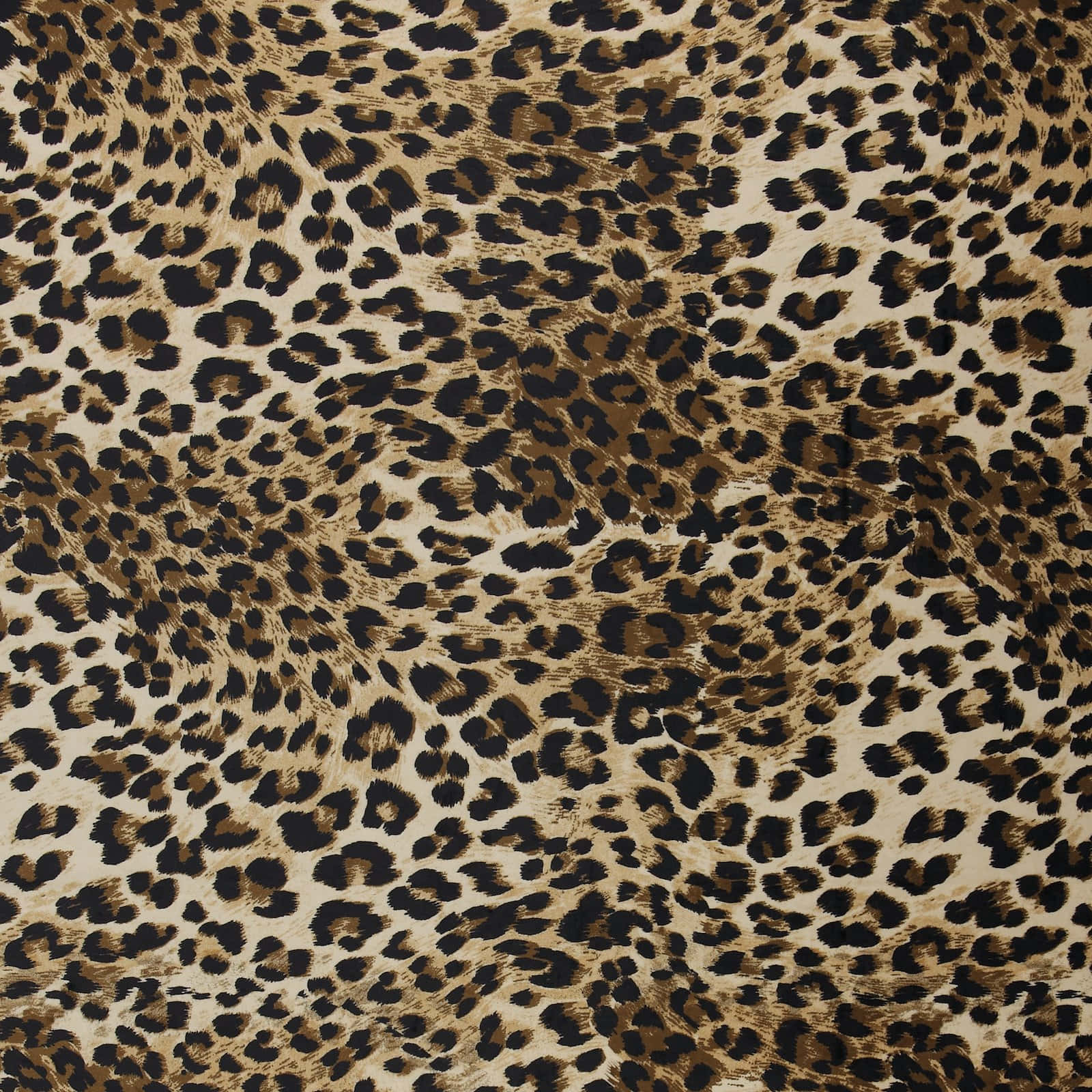 Animal Fur 桌布 壁紙 — 近距離拍攝的豹紋布料，質感豐富，在棕褐色和棕色背景上有大膽的黑色斑點。