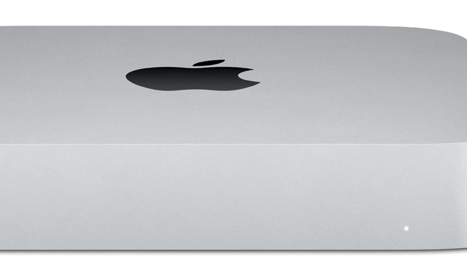 Mac 桌布 壁紙 — 近距離拍攝的銀色 Apple Mac mini，帶有黑色標誌和一個柔和發光的狀態指示燈。