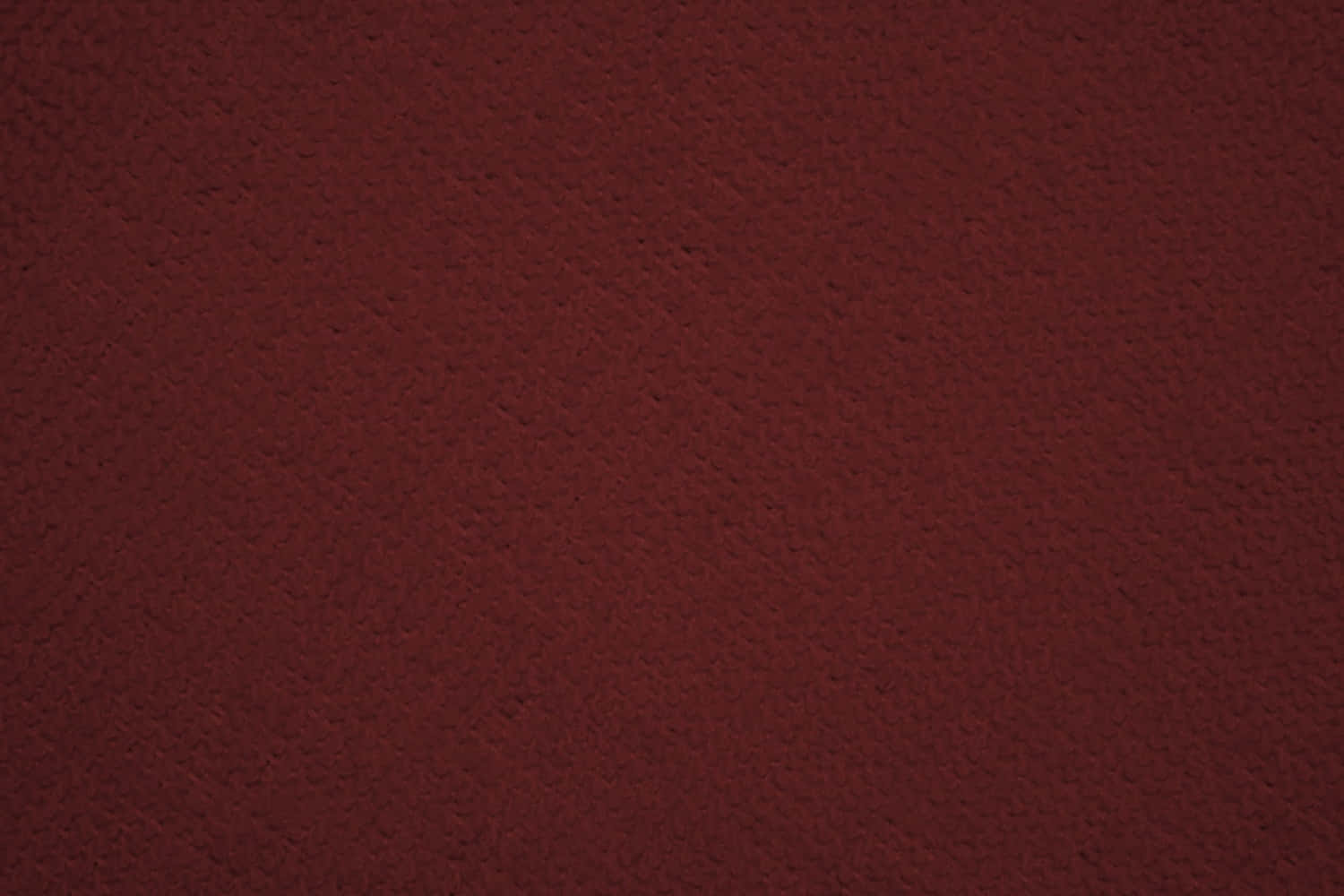 Fabric 桌布 壁紙 — 近距離拍攝豐富的酒紅色紋理布料，帶有細微的紋理圖案和柔和光線。