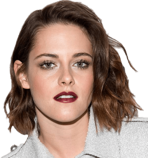 Kristen 桌布 壁紙 — 近距離肖像照，一位擁有波浪棕色頭髮和鮮豔紅唇的女性，身穿淺灰色外套。
