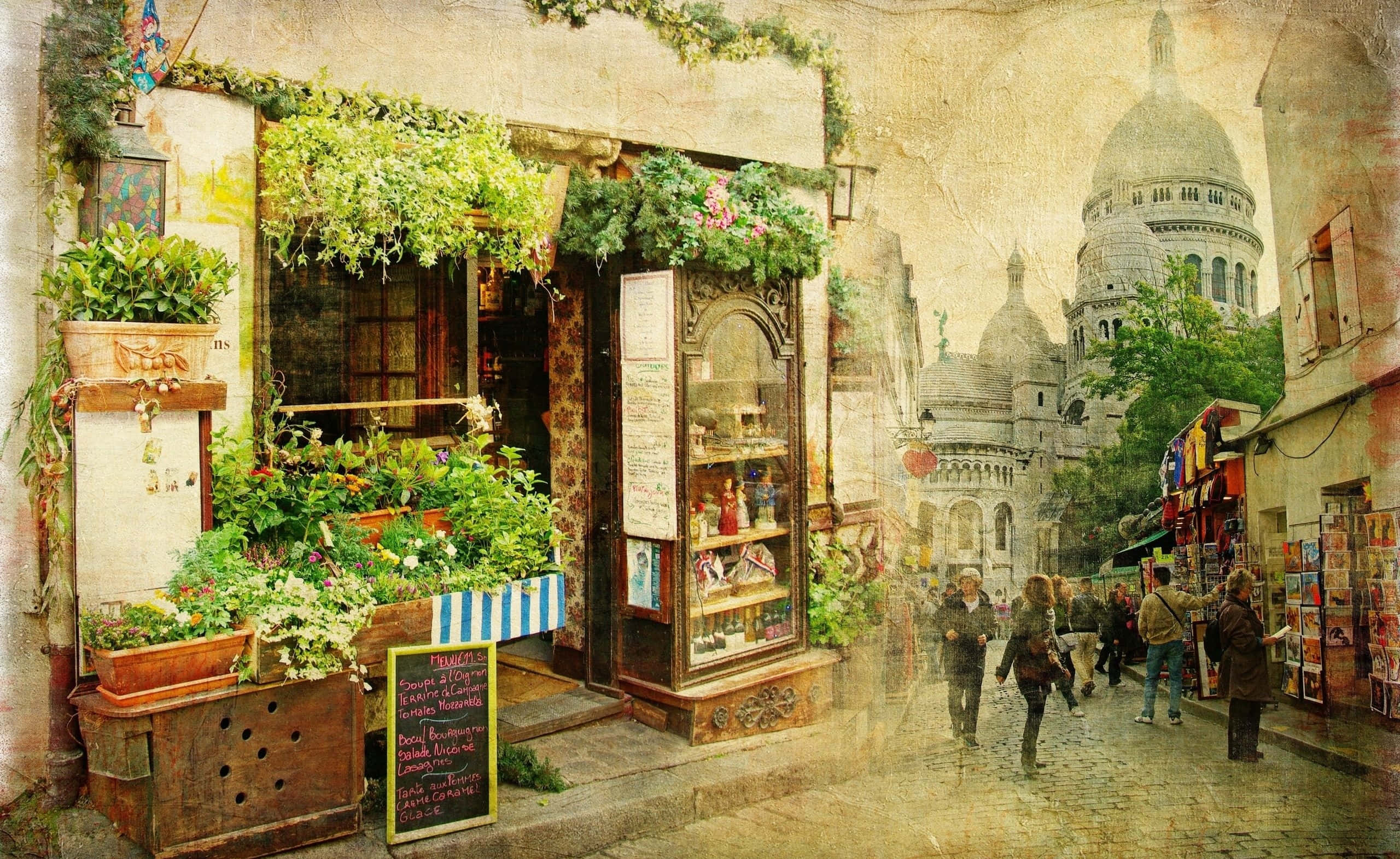 復古 桌布 壁紙 — 迷人的巴黎街景，花店櫥窗滿佈鮮花，遠處的聖心大教堂在溫暖的金色光芒下。