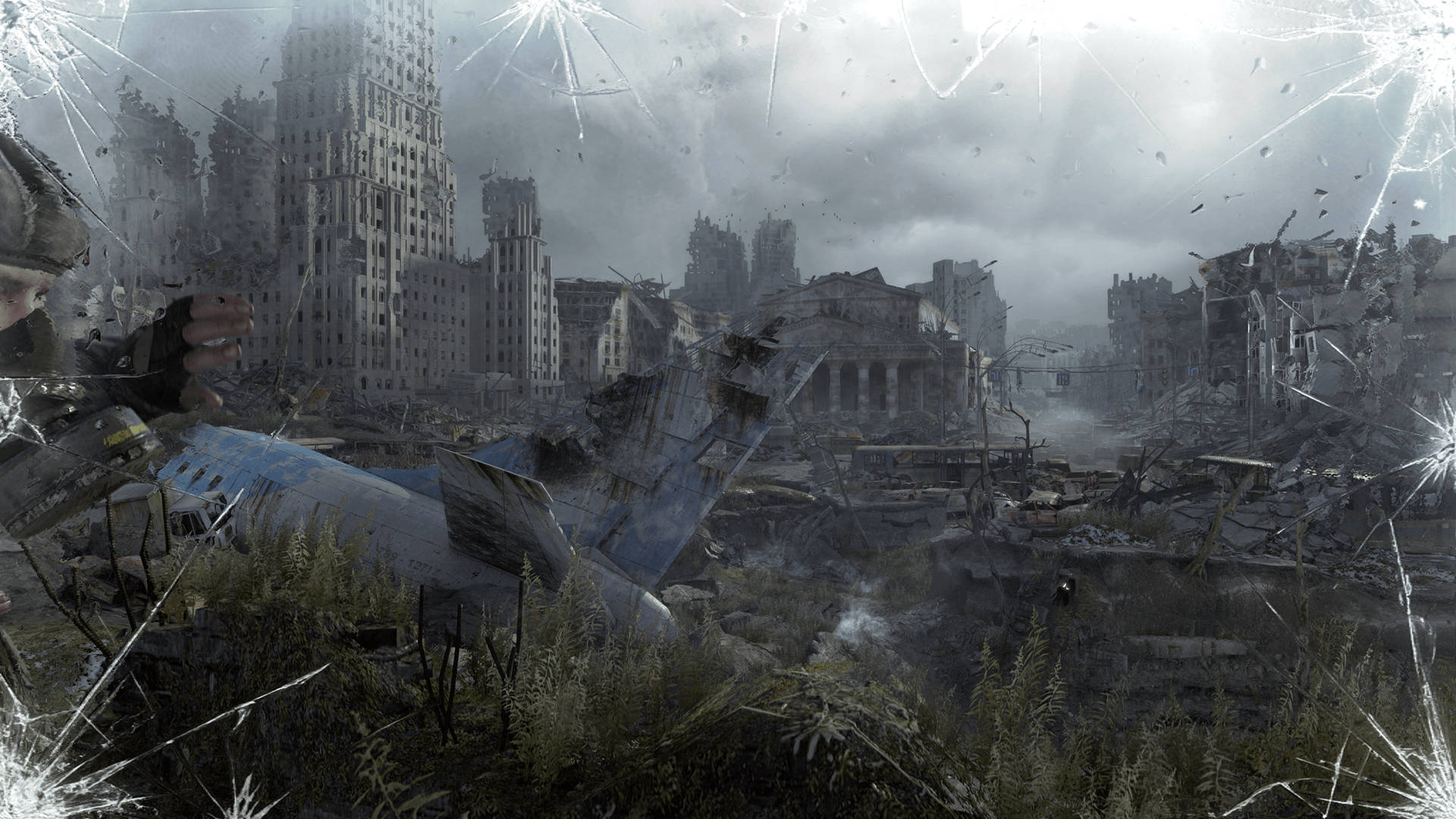 Metro Exodus 桌布 壁紙 — 透過破碎玻璃框架看到的廢墟城市景觀，摩天大樓 crumbling 和茂密植被，陰沉天空下。
