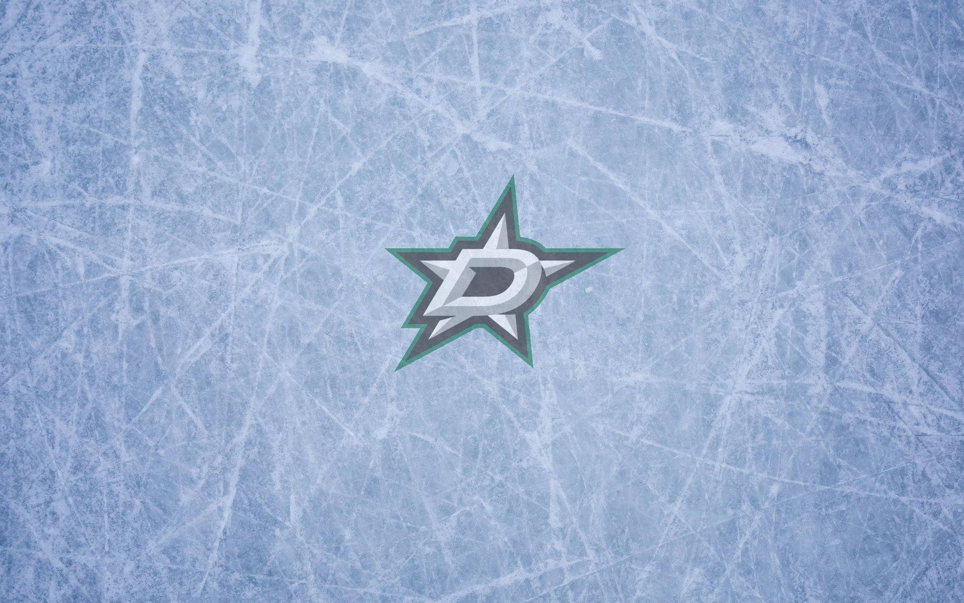 Dallas Stars 桌布 壁紙 — 達拉斯星隊標誌居中於帶有刮痕的冰面場地上，呈現冰藍色調。
