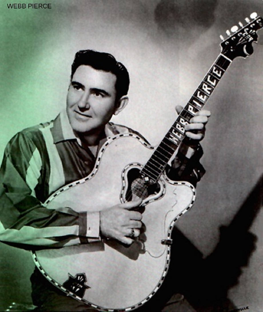 音樂 桌布 壁紙 — 鄉村歌手韋伯·皮爾斯（Webb Pierce）的復古肖像，他手持標誌性吉他，背景為煙霧彌漫的綠色。