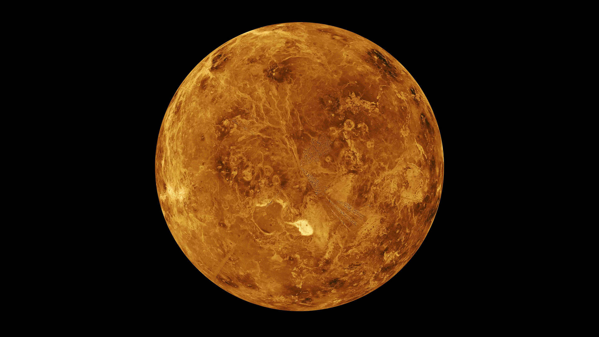 太陽系 桌布 壁紙 — 金星的近距離視圖，在黑色虛空中帶有紋理的橙色和棕色雲層發光。