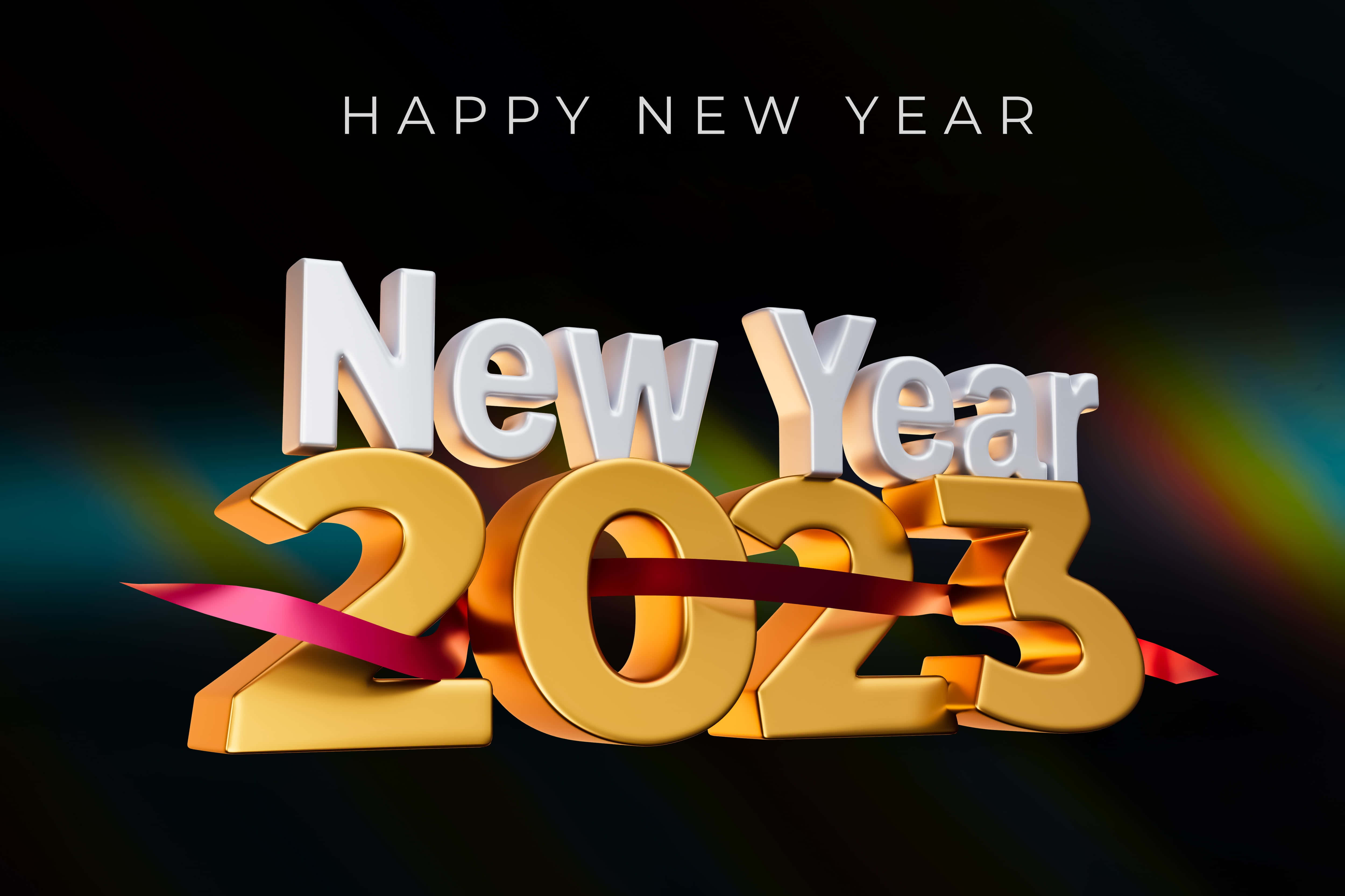 新年 桌布 壁紙 — 金色3D文字「新年2023」用紅色絲帶綁在深色漸變背景上，帶有彩虹光條。