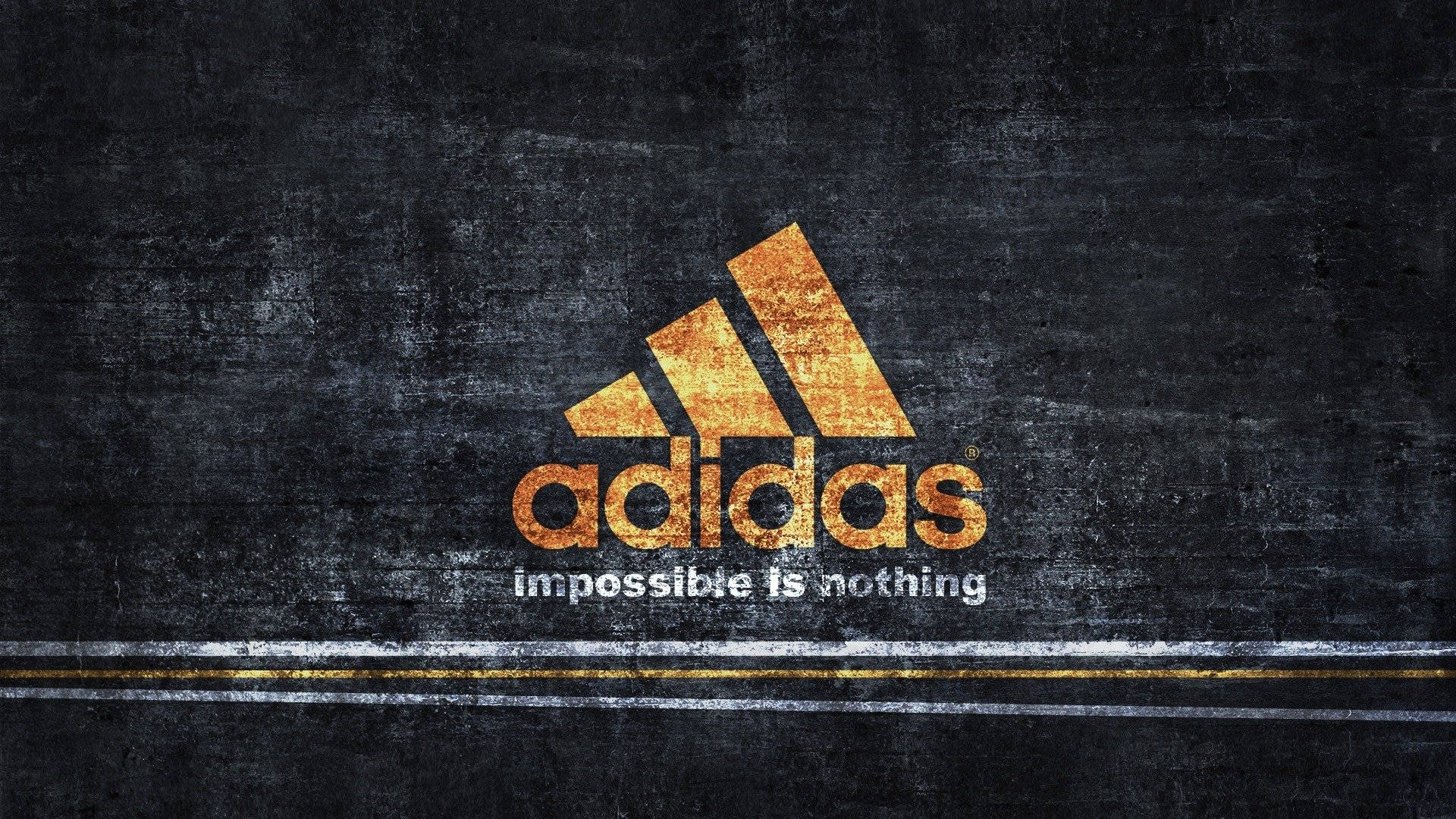 愛迪達 桌布 壁紙 — 金色Adidas標誌，配上'impossible is nothing'口號，背景為粗糙的深色瀝青路面。
