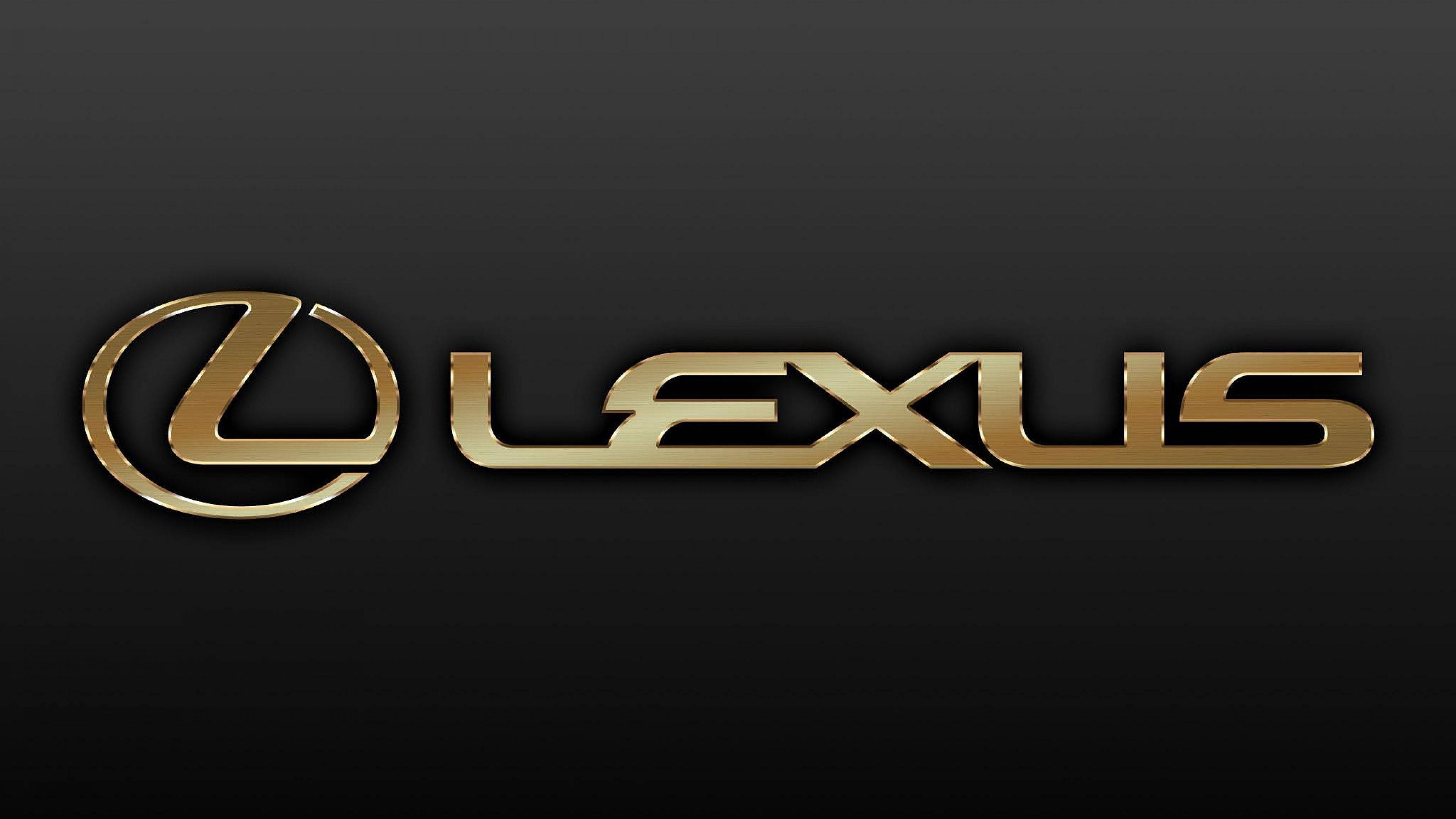 Lexus 標誌 桌布 壁紙 — 金色Lexus標誌在時尚的黑色漸變背景上閃耀著金屬光澤。