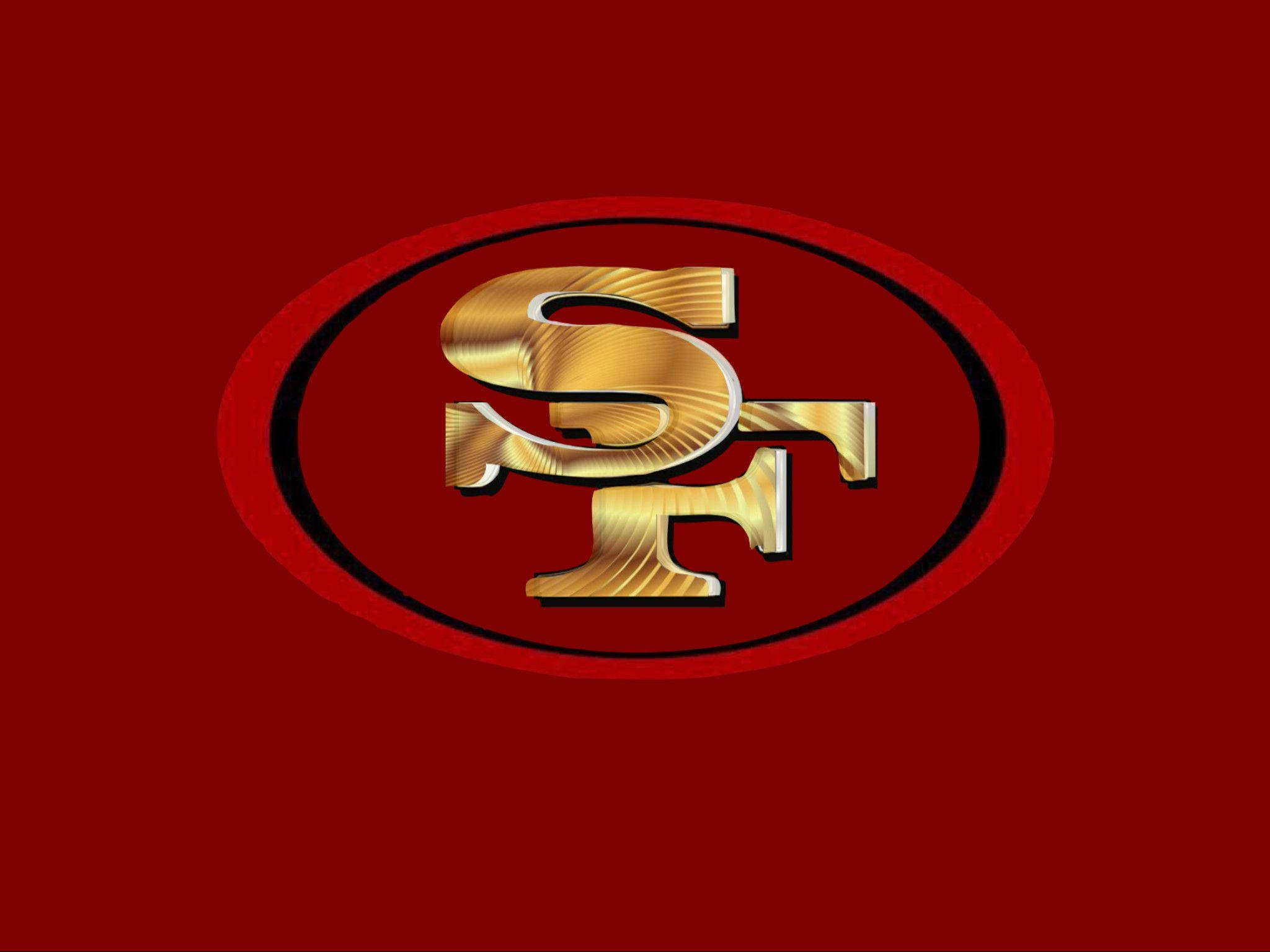 49ers 桌布 壁紙 — 金色SF標誌，帶有金屬質感，居中於一個大膽的黑色橢圓形內，背景為深紅色。