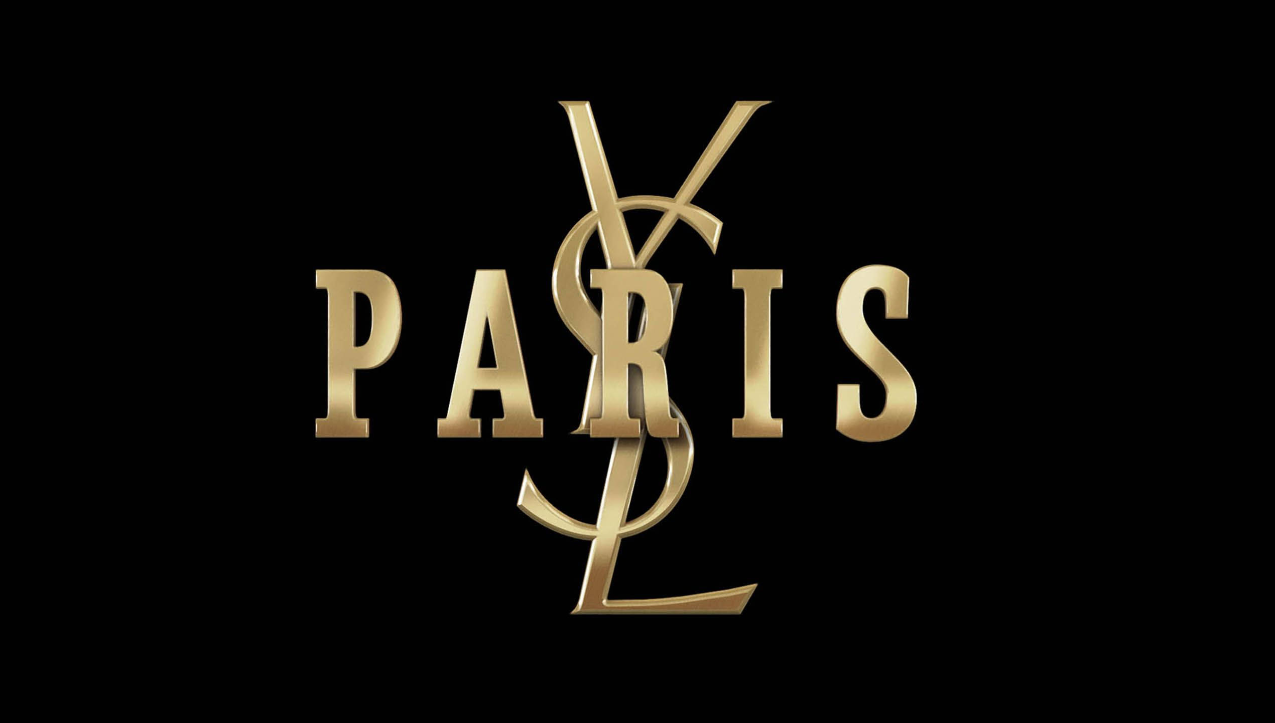 YSL 桌布 壁紙 — 金色YSL標誌與PARIS字樣交織在純黑背景上。