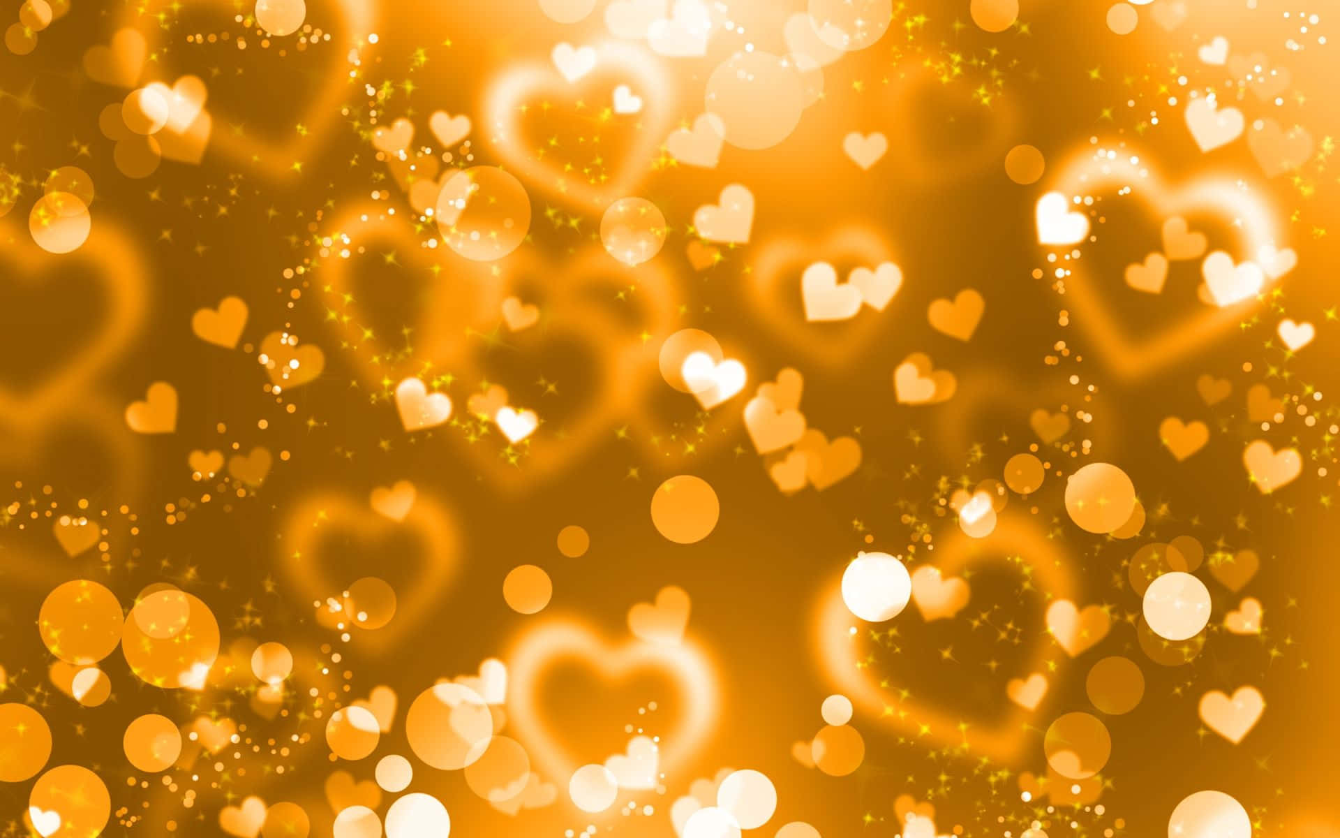 Gold Glitter 桌布 壁紙 — 金色心形和散景光在溫暖發光的背景中閃爍。