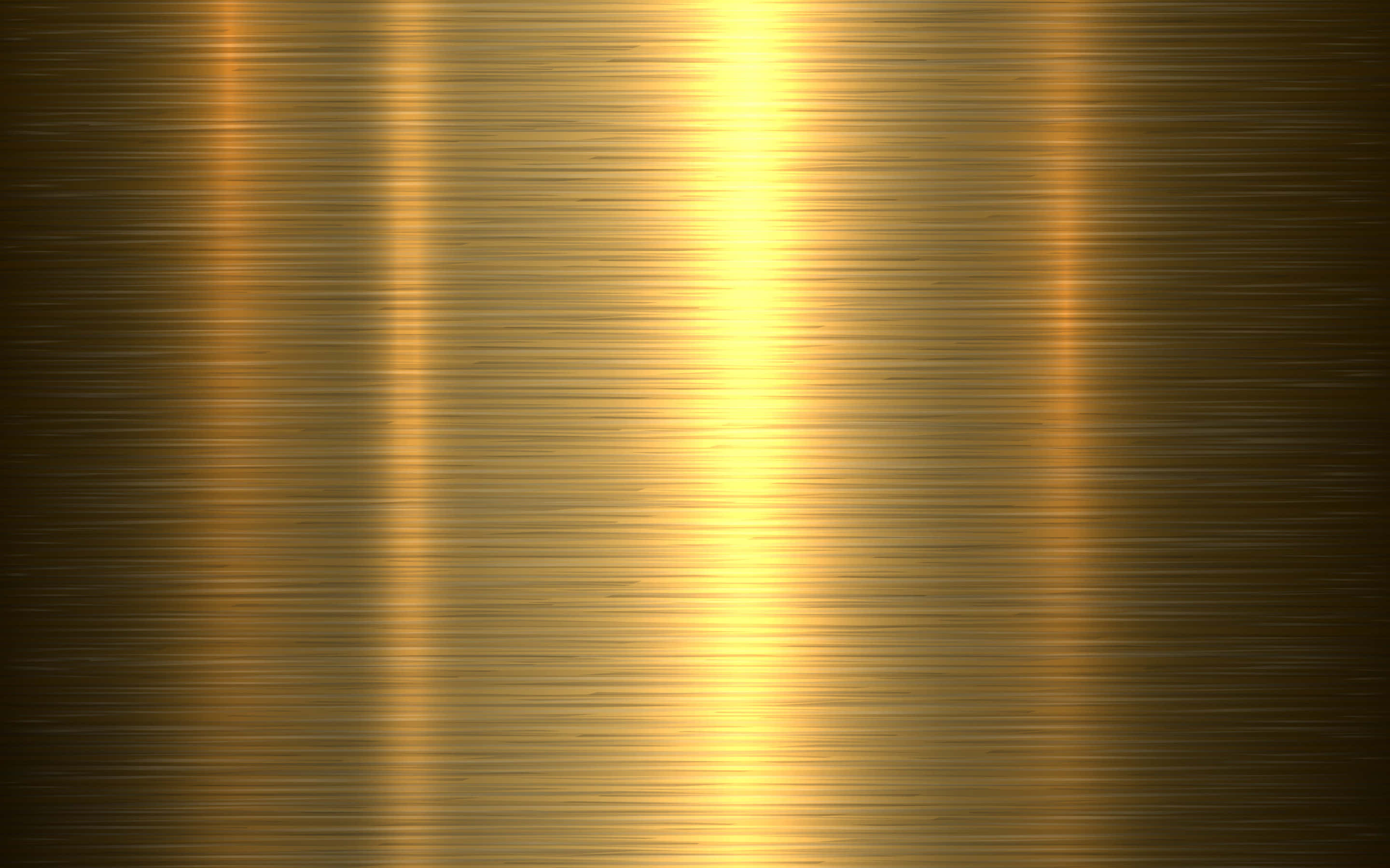 Shiny Gold 桌布 壁紙 — 金色拉絲金屬表面，帶有垂直光條，反射溫暖的環境光暈。