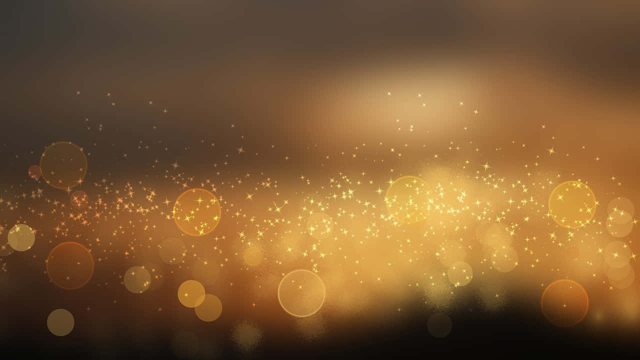 lights 桌布 壁紙 — 金色散景燈光和閃爍粒子漂浮在溫暖的漸變背景上。