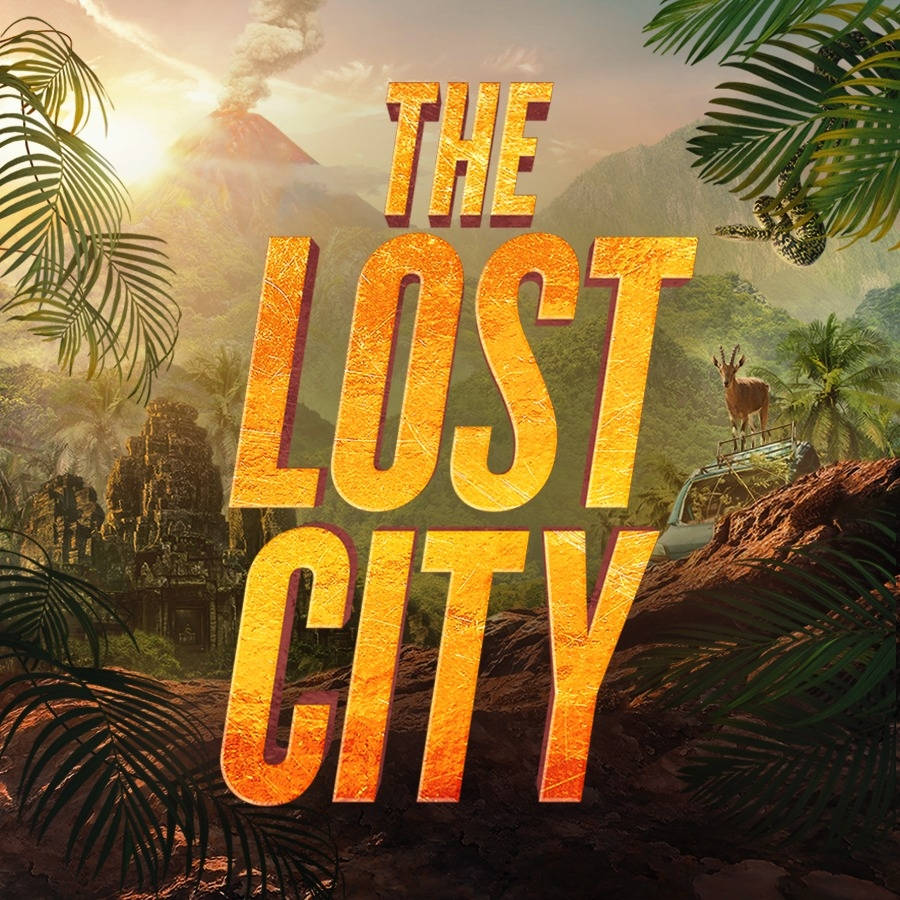 lost 桌布 壁紙 — 金色標題文字顯示「THE LOST CITY」，背景為叢林場景，有冒煙的火山和一隻鹿在車上。
