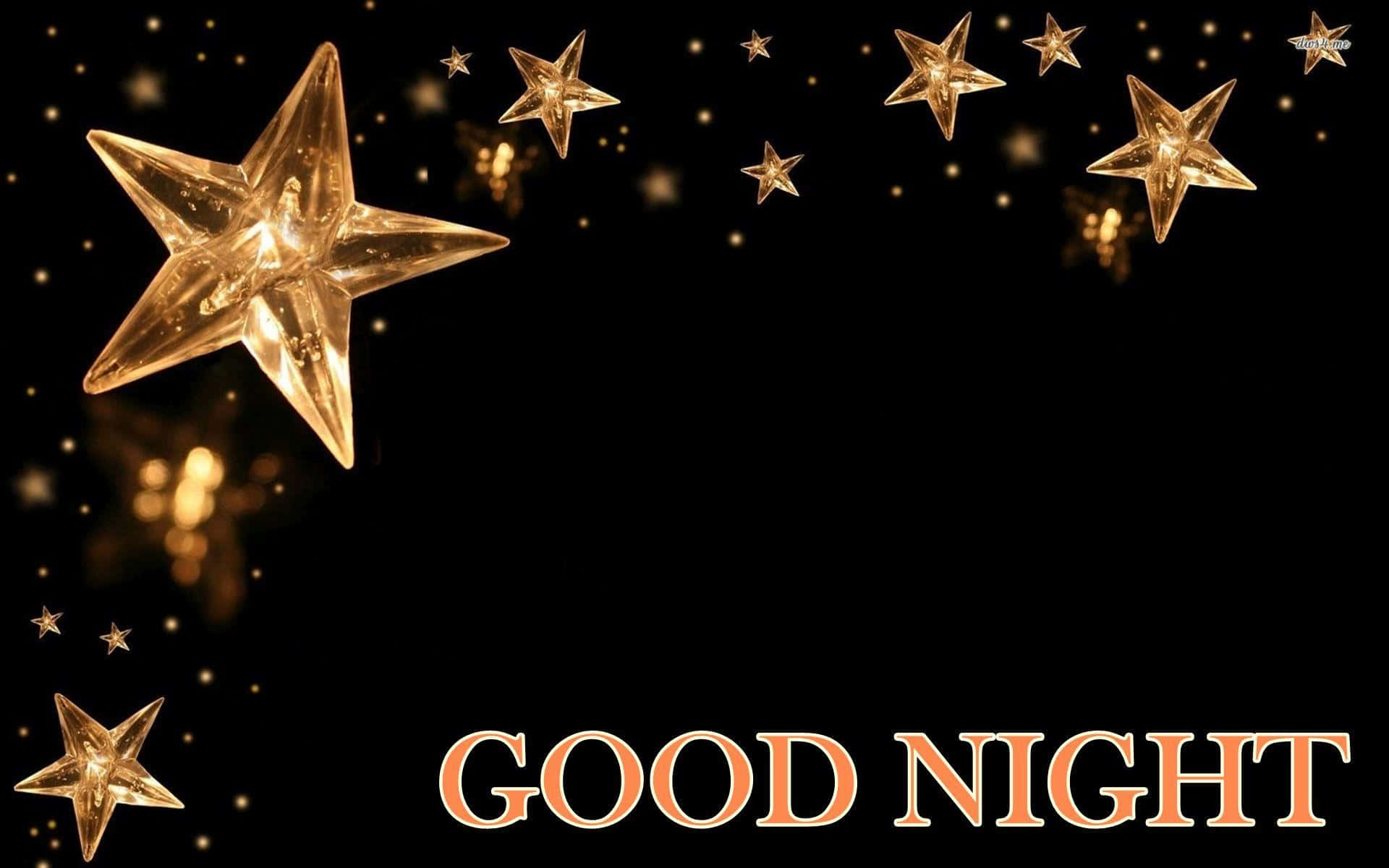 good night animated 桌布 壁紙 — 金色發光的星星在黑色背景上漂浮，帶有暖橙色的「GOOD NIGHT」文字。