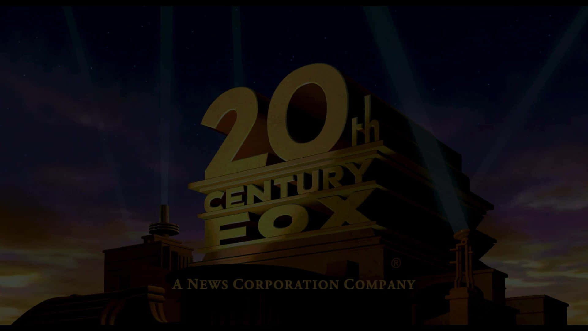 標誌 桌布 壁紙 — 金色的20th Century Fox標誌在繁星點點的黃昏天空下被聚光燈照亮。