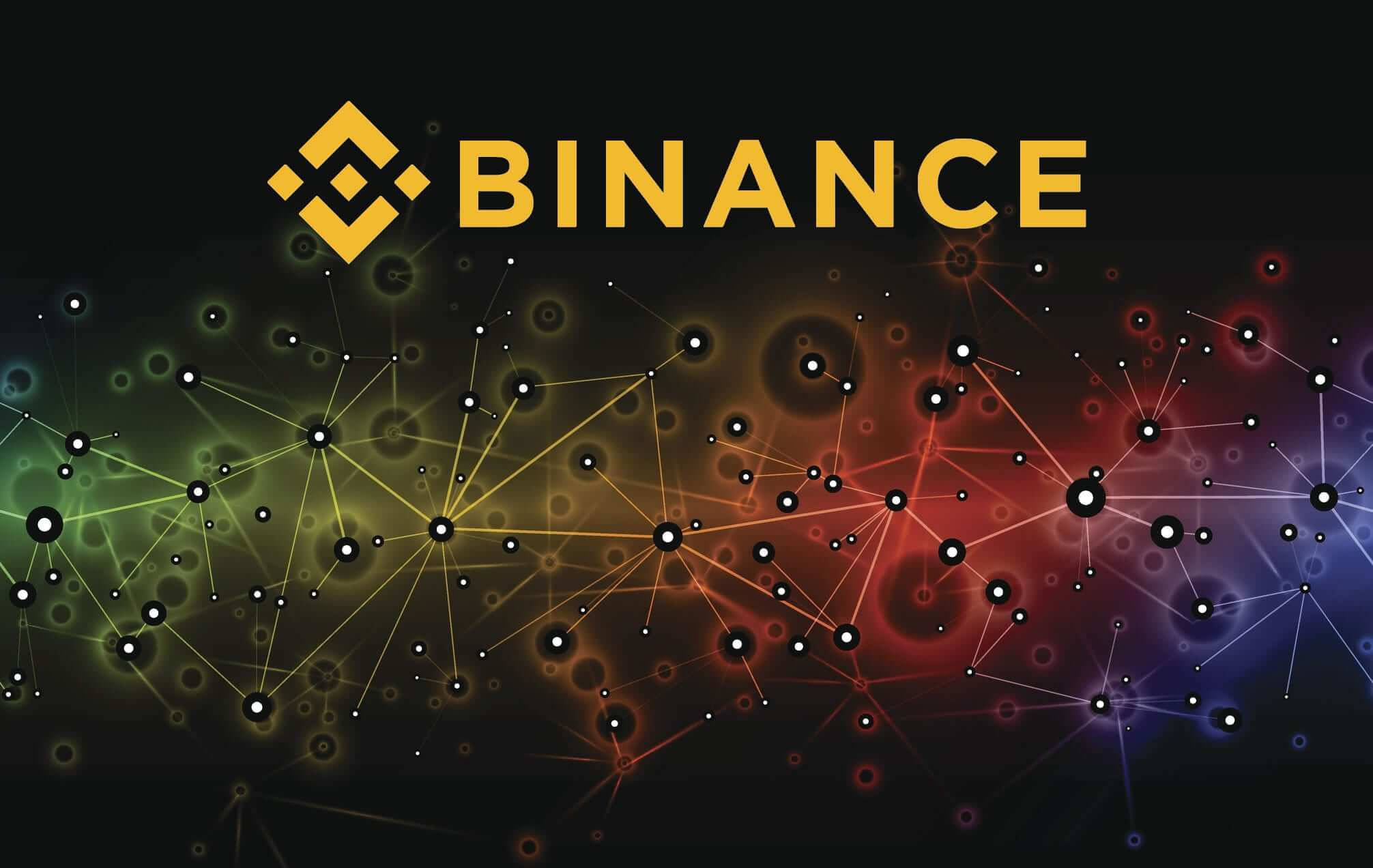 Binance 桌布 壁紙 — 金色的Binance標誌在黑暗背景上脫穎而出，帶有發光的相互連接節點，呈現鮮豔彩虹色調。