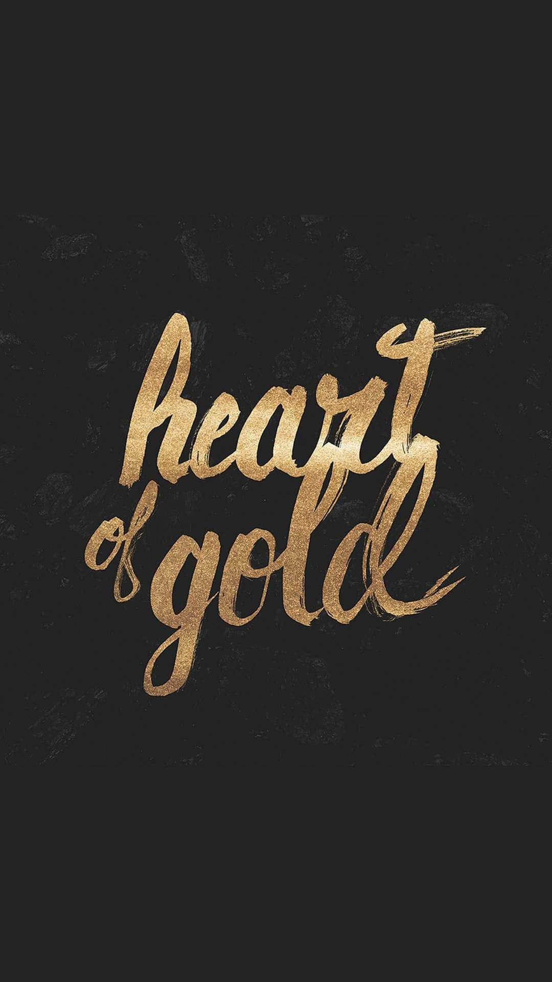 金色動態 桌布 壁紙 — 金色筆觸文字 heart of gold 在紋理黑色背景上發光。