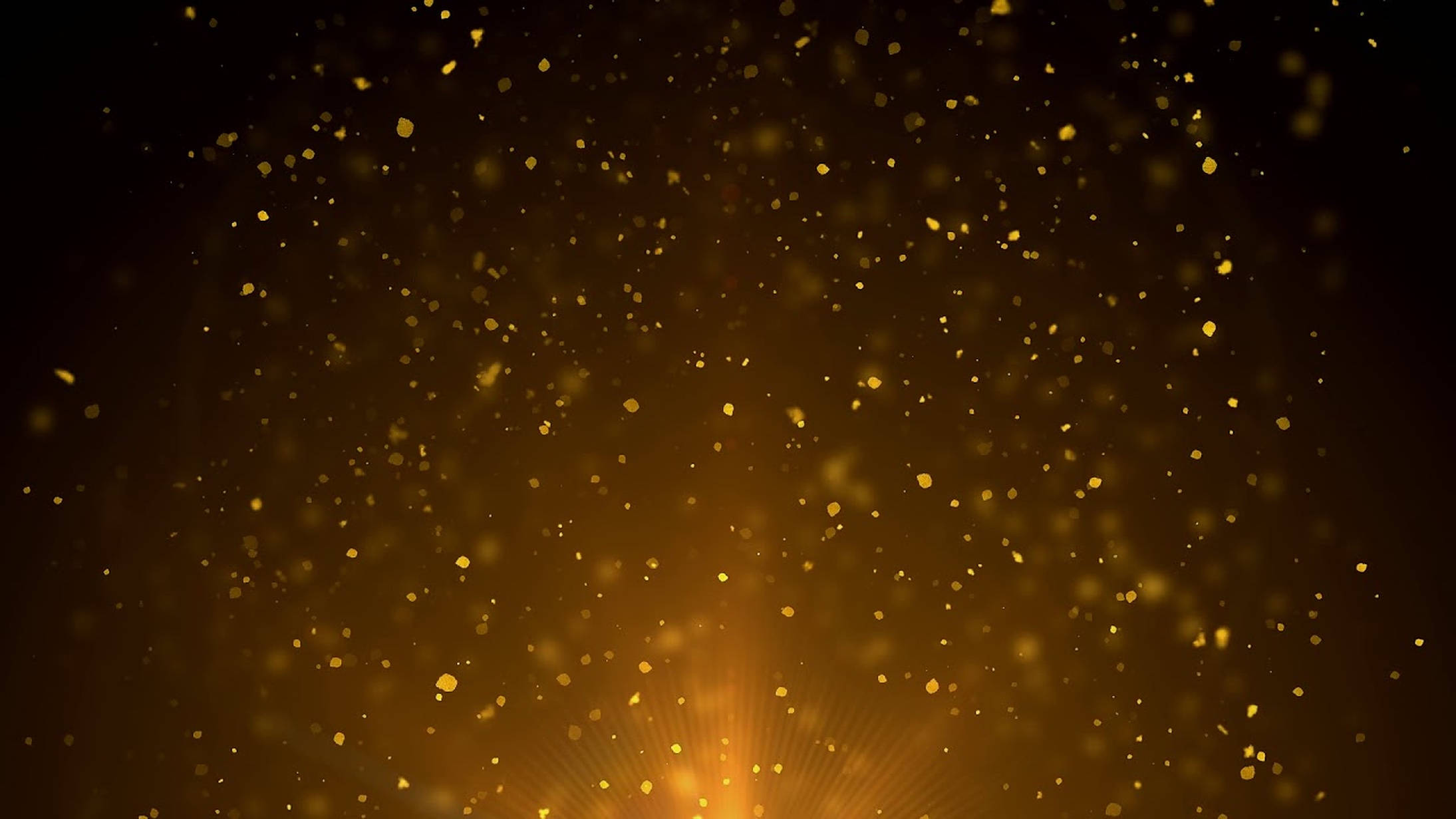 Dust 桌布 壁紙 — 金色粒子在黑暗背景上的光芒中漂浮，營造出神奇的發光效果。