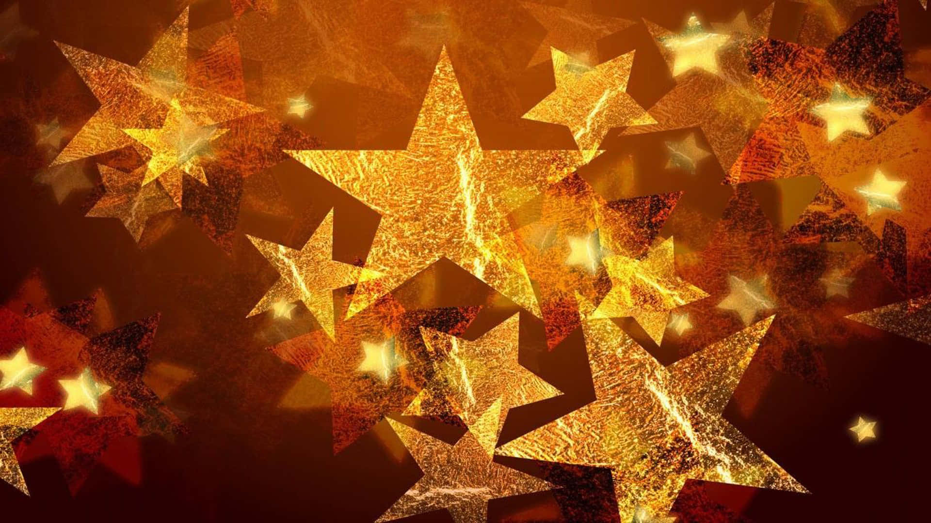 Christmas Star 桌布 壁紙 — 金色紋理星星在豐富琥珀色和深紅色抽象背景上發光，帶有耀眼的光效。