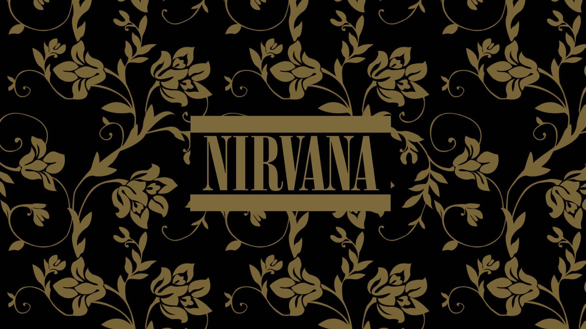 nirvana 4K 桌布 壁紙 — 金色花卉藤蔓圍繞著粗體襯線字體 NIRVANA 一詞，背景為純黑色。