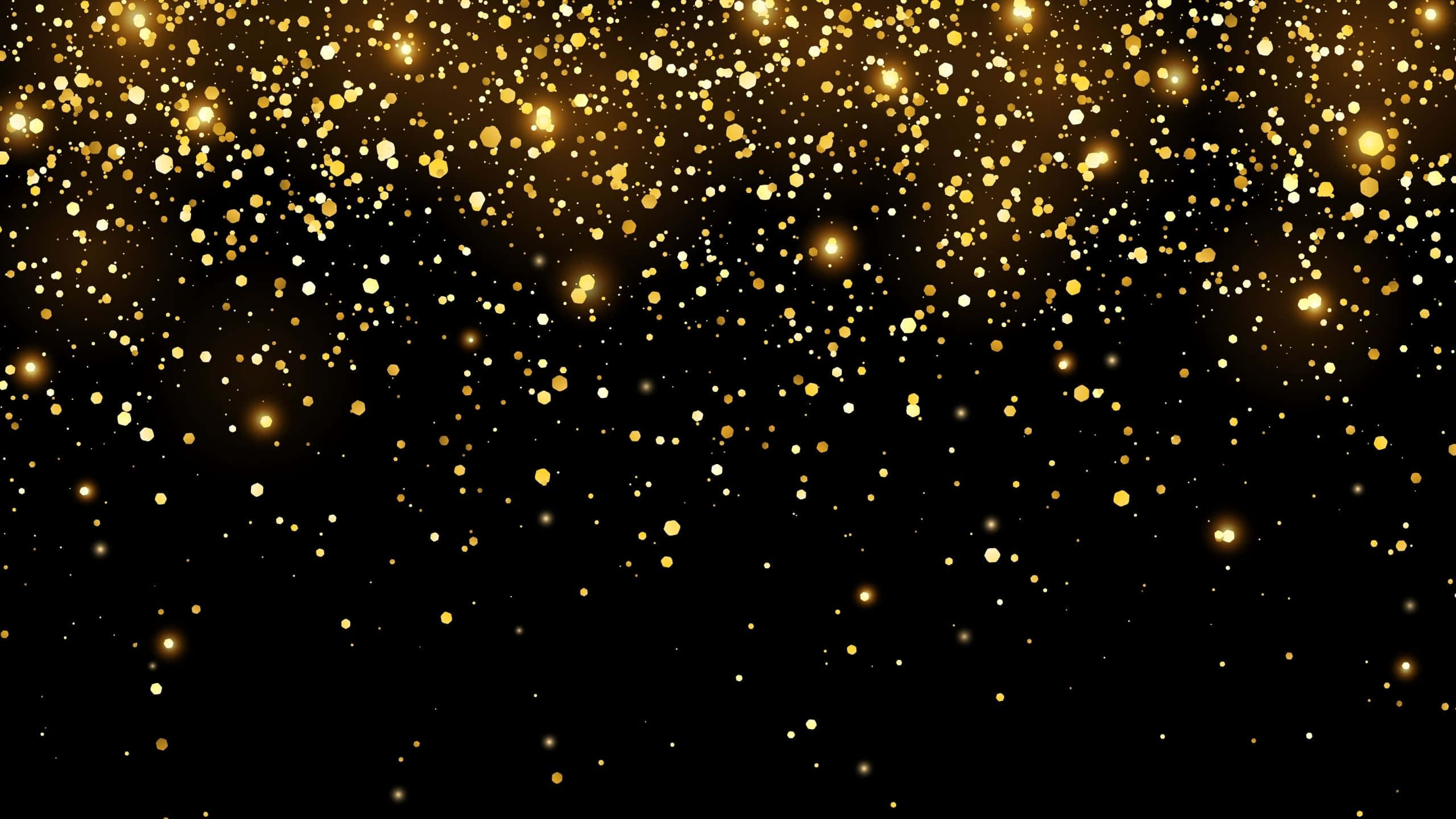 Black And Gold Glitter 桌布 壁紙 — 金色閃粉粒子在深黑色背景上漂浮閃爍，營造出奢華的節日氣氛。