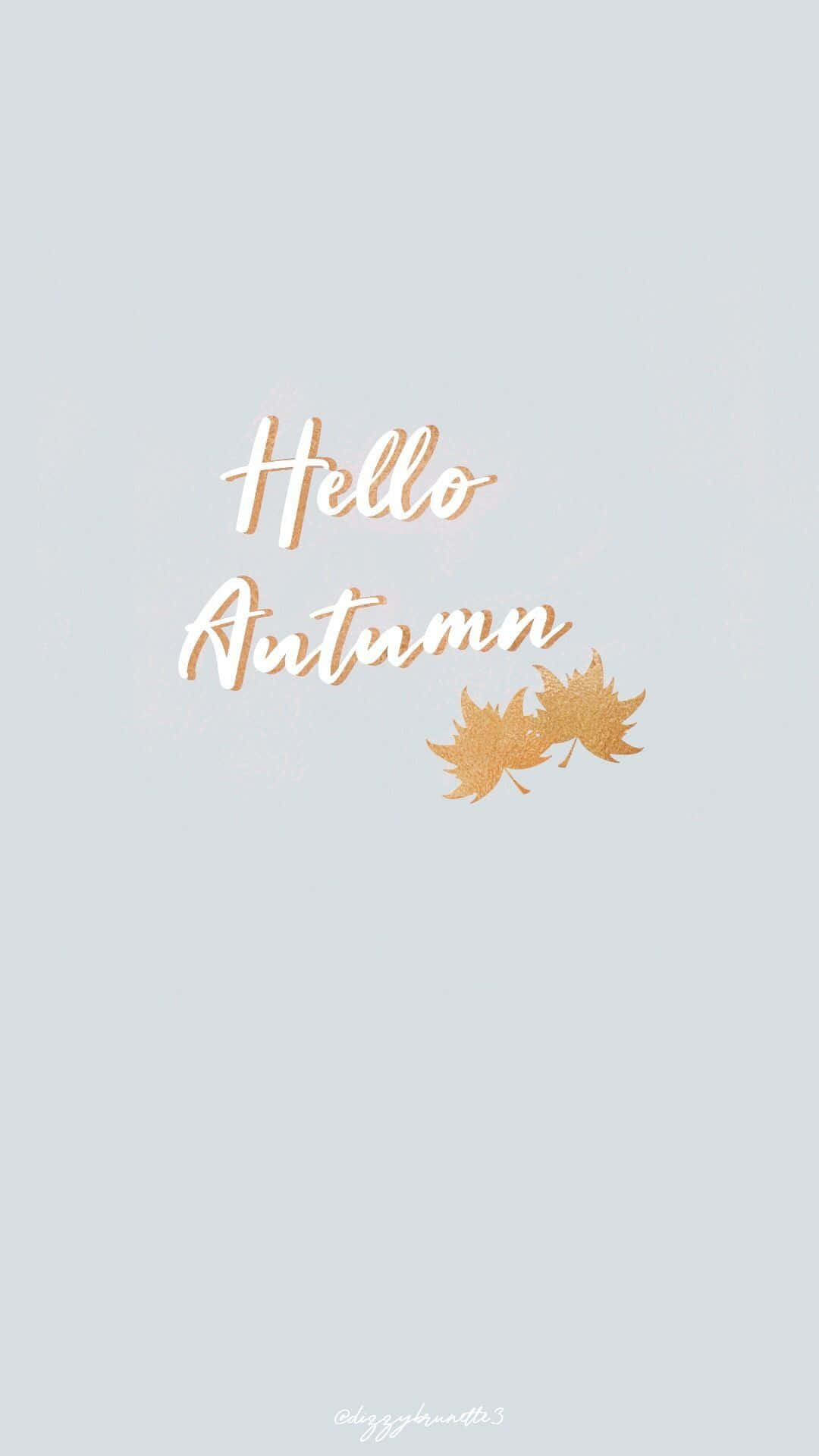 Fall Phone 桌布 壁紙 — 金色閃閃發光的秋葉和草書hello autumn文字漂浮在柔和的灰色背景上。