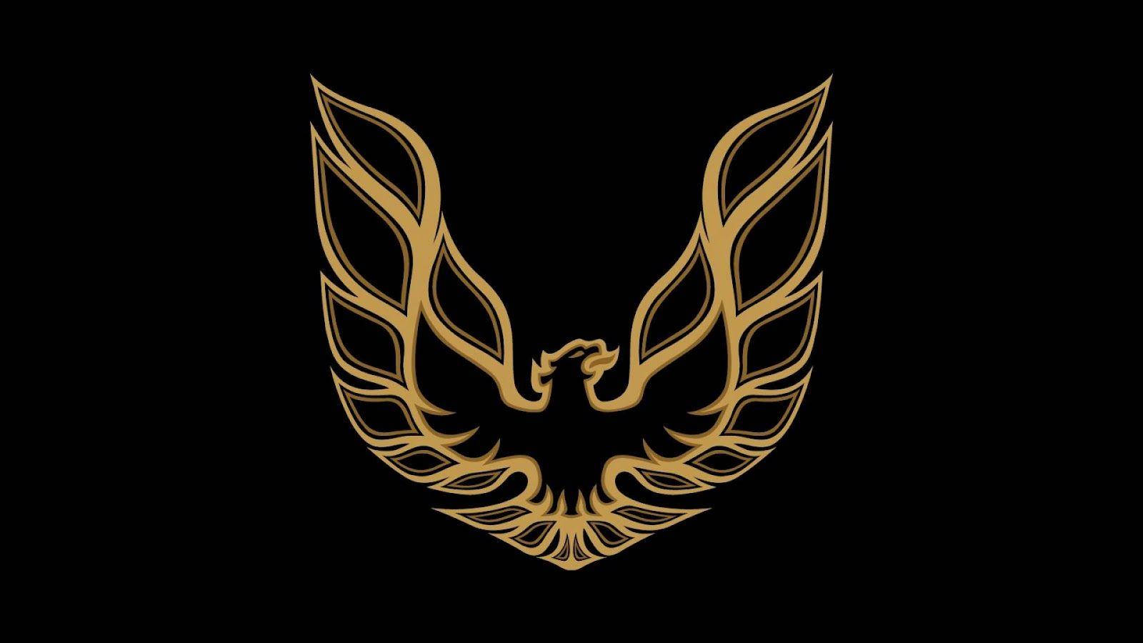 Cool Logos 桌布 壁紙 — 金色風格化的鳳凰標誌，翅膀展開，襯以純黑色背景。